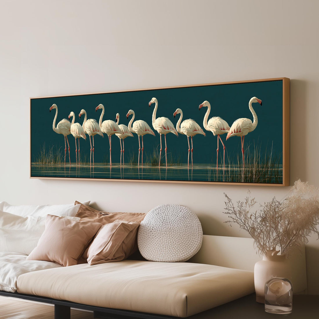 Pale flamingos wading on teal long horizontal canvas print above a sofa in a living room