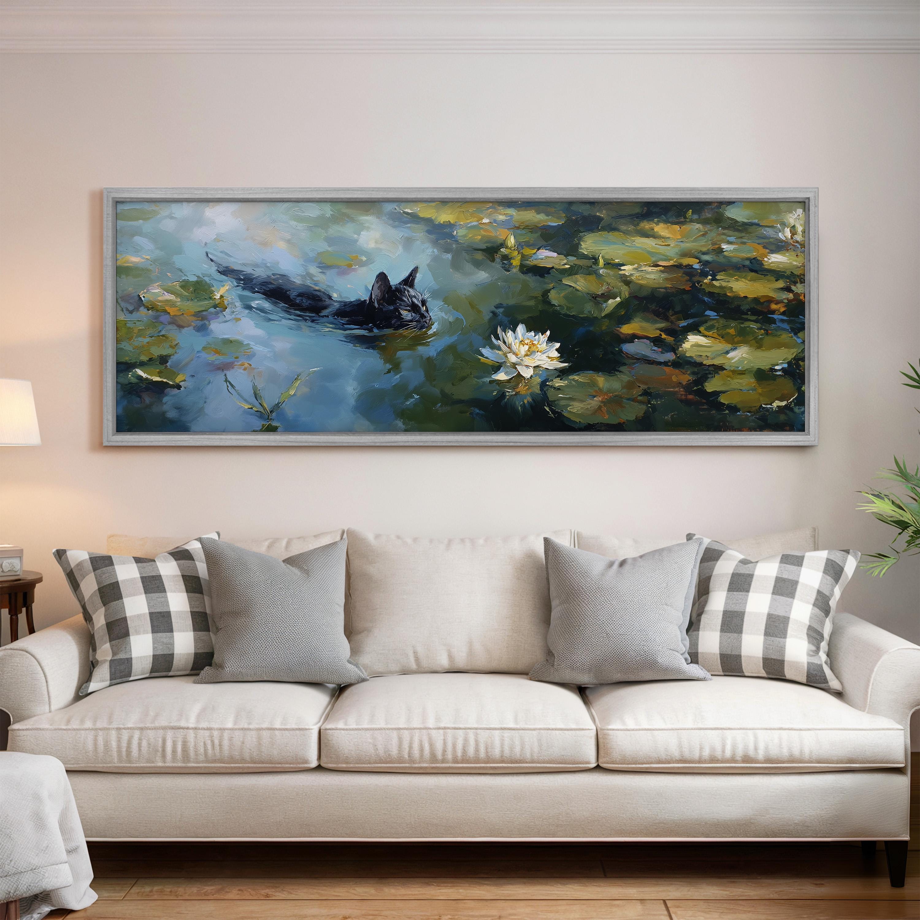 a large painting of a black cat swimming in a pond with lily pads, hanging on a wall above a white couch with gray and white plaid throw pillows.