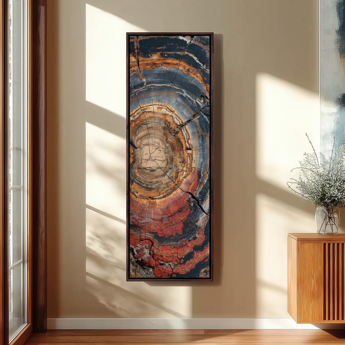 a large, colorful abstract painting hanging on a white wall in a modern living room setting.