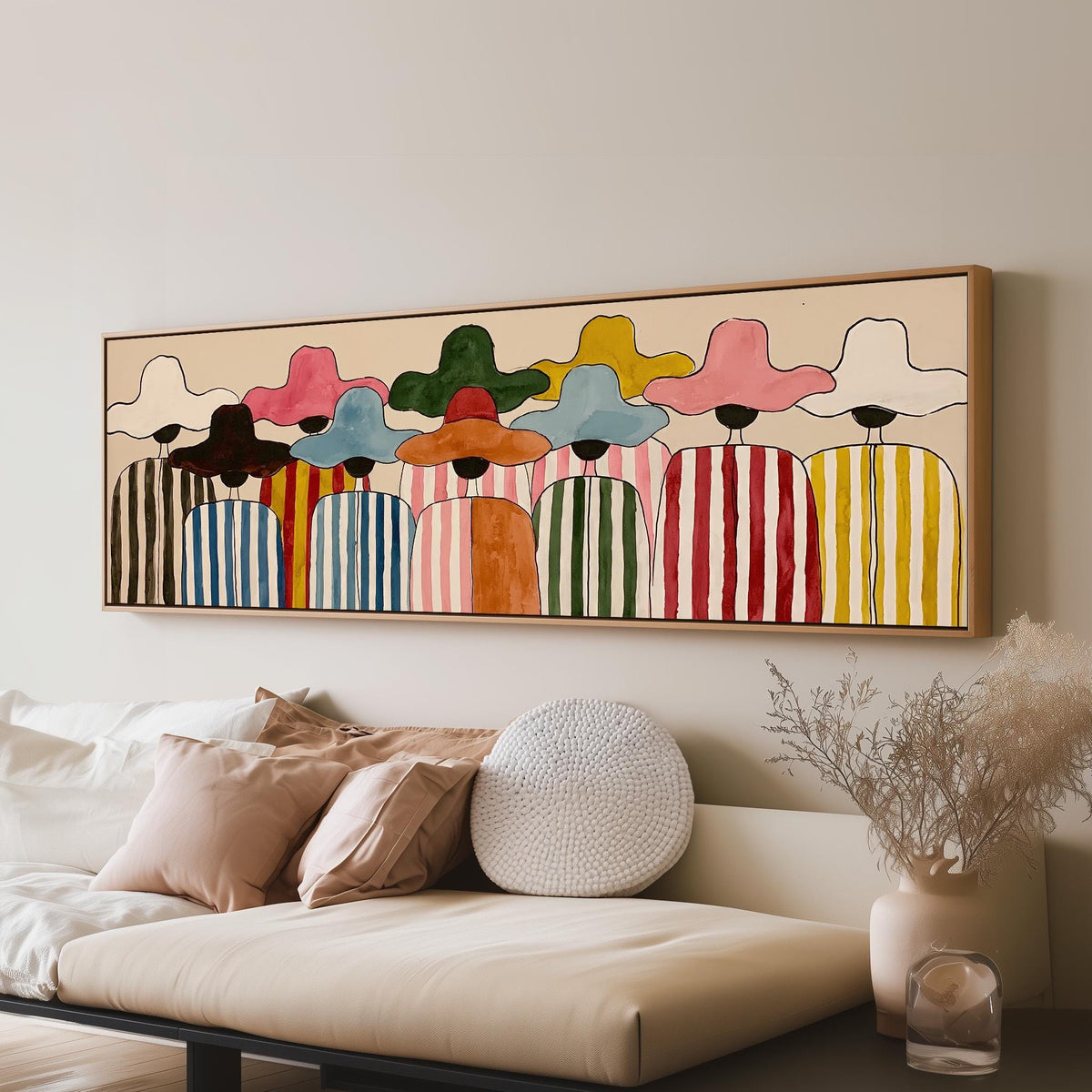 Crowd of figures in colorful sun hats panoramic canvas print above a sofa in a living room