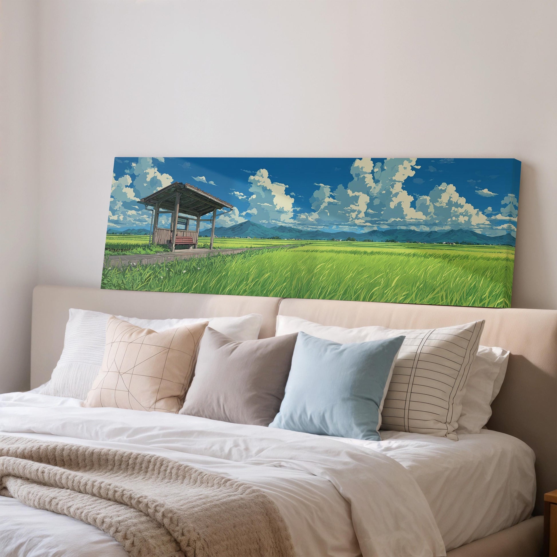 a large painting of a serene landscape with a grassy field, a wooden structure, and a blue sky with white clouds.