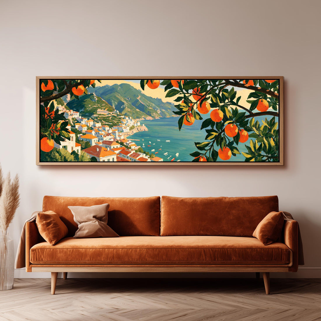 Italian coastal village seen through orange trees long horizontal canvas print above a sofa in a living room