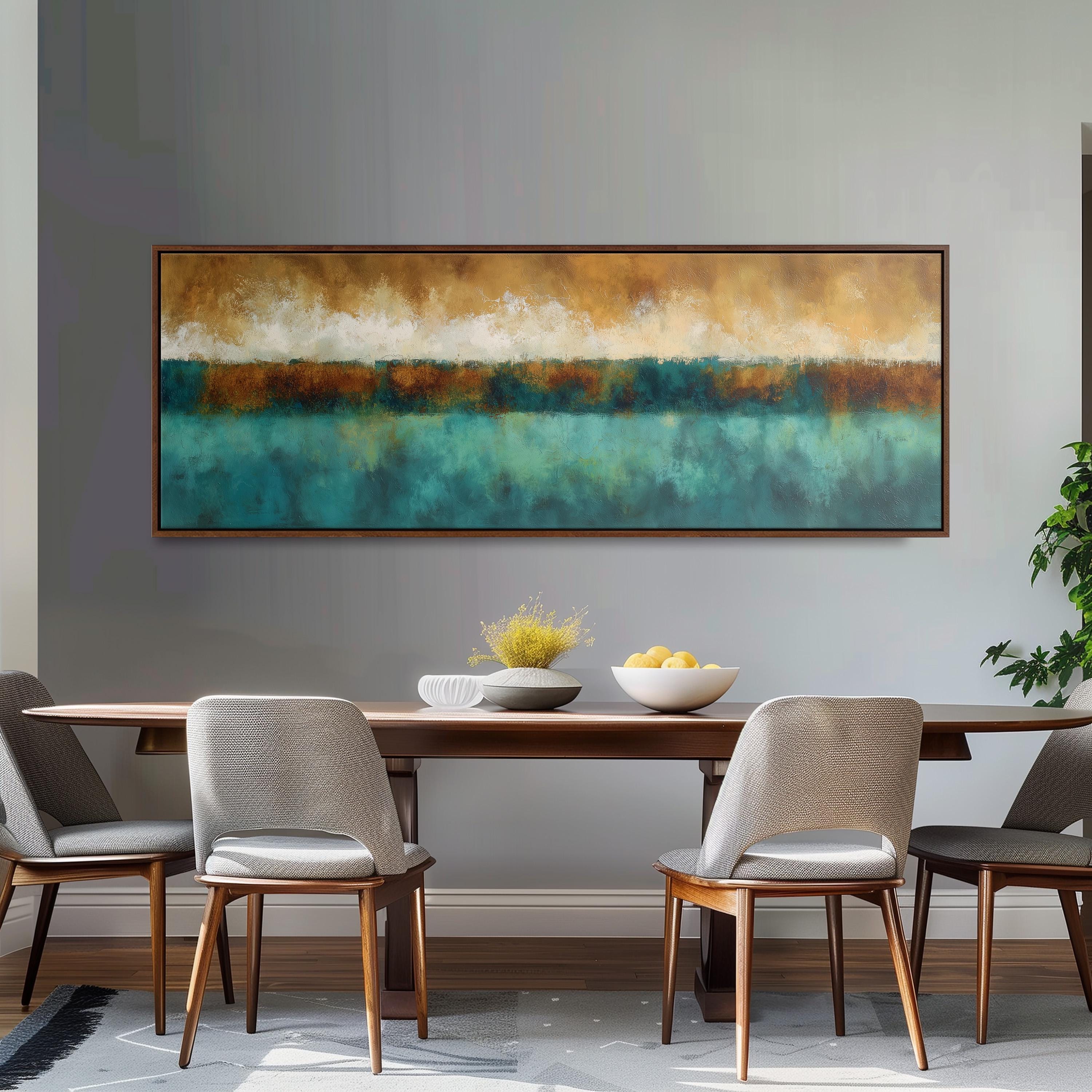 a dining room with a large, colorful painting hanging on the wall above a wooden dining table with four chairs. The table is set with a bowl of fruit and a vase of flowers, creating a welcoming and inviting atmosphere.