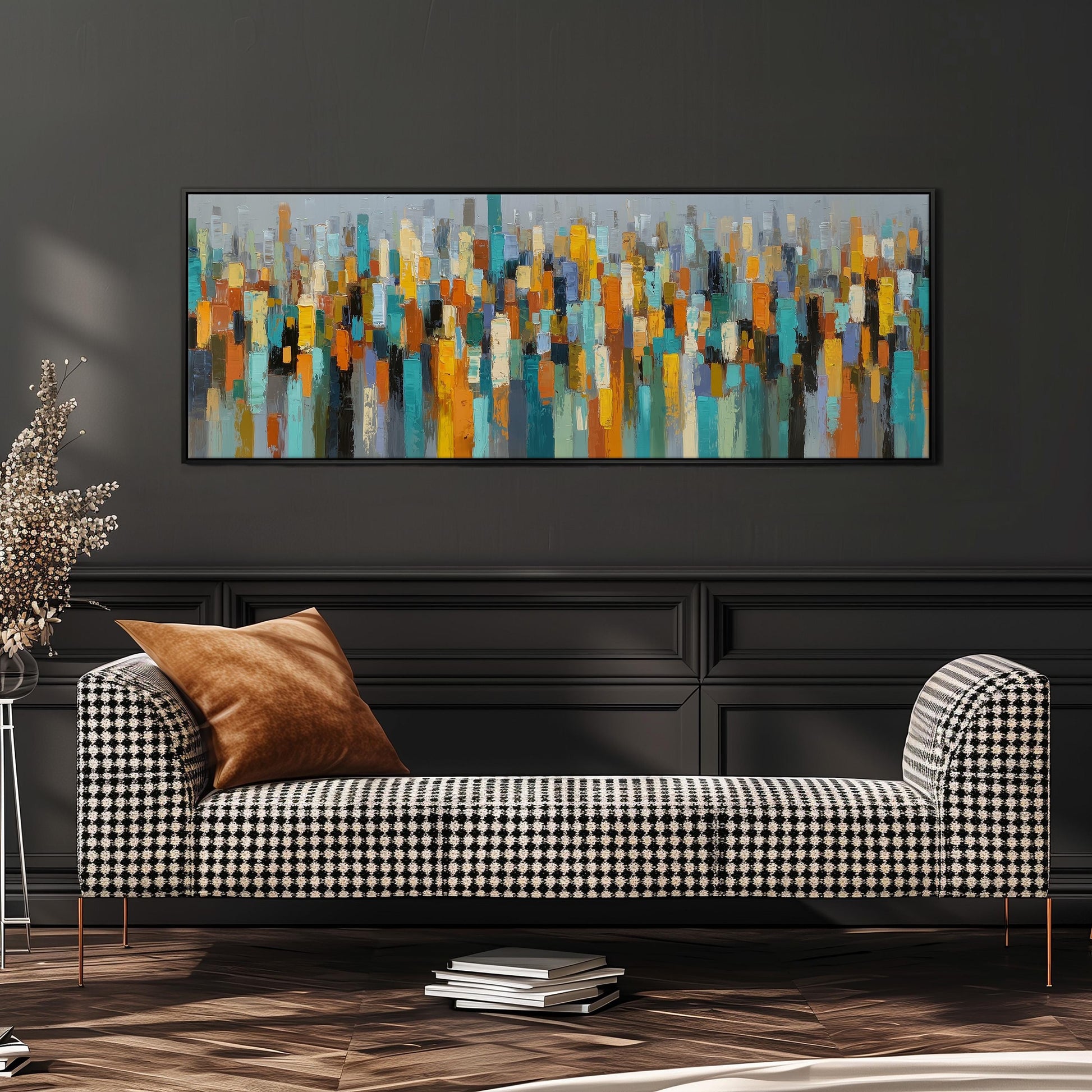 a modern living room with a black and white checkered sofa, a stack of books, and a large abstract painting hanging on the wall above the sofa.