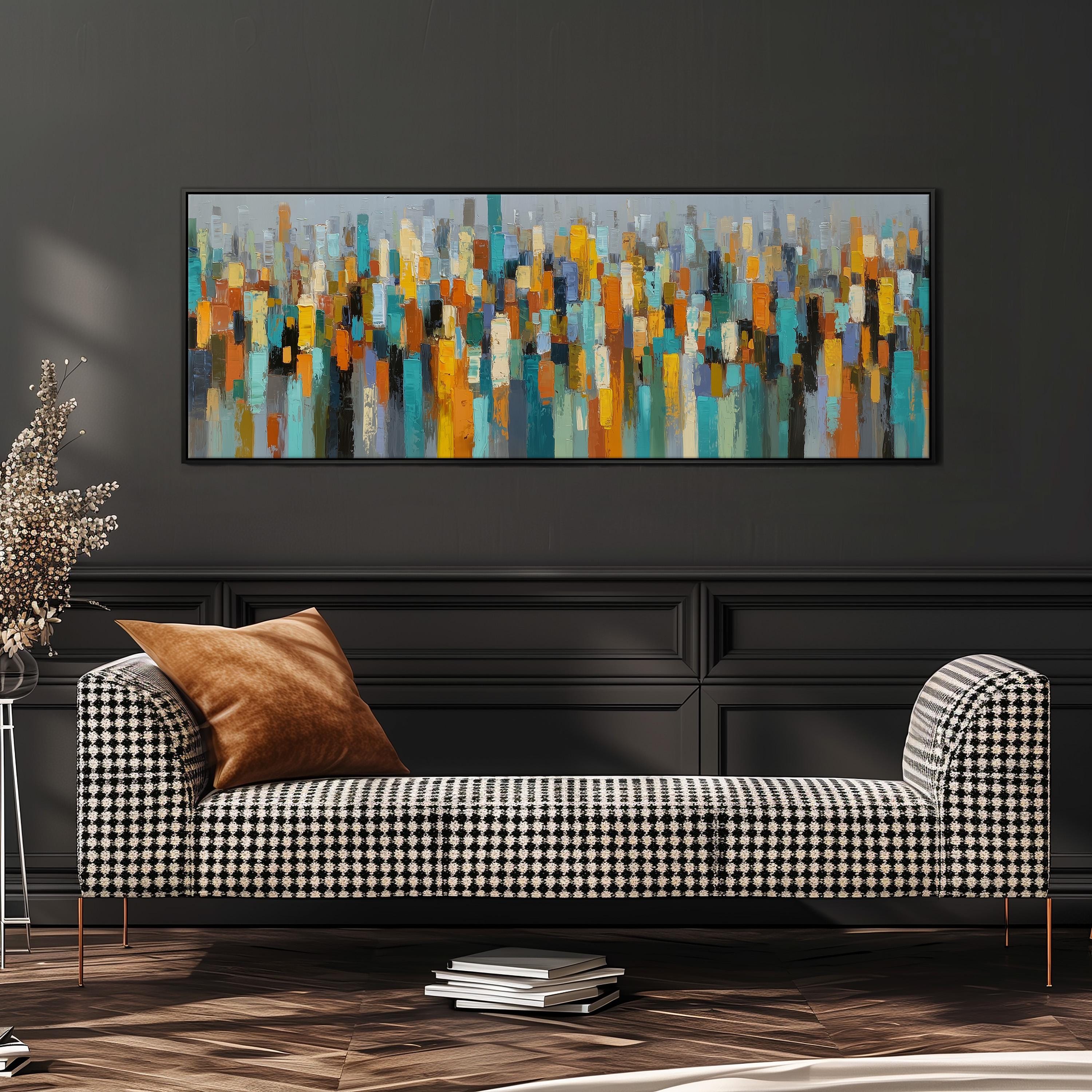 a modern living room with a black and white checkered sofa, a stack of books, and a large abstract painting hanging on the wall above the sofa.