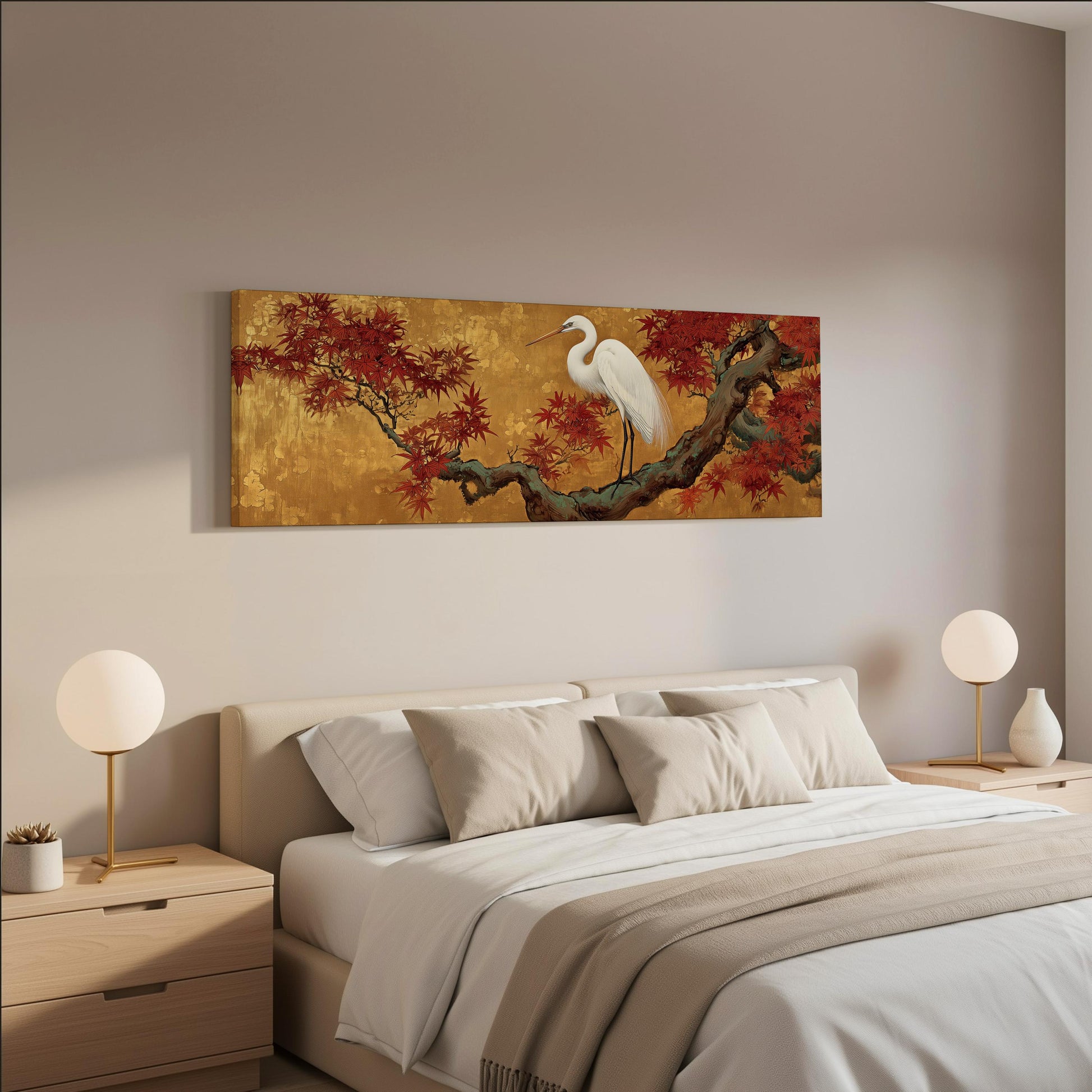a serene bedroom scene with a large bed adorned with white pillows and a beige blanket. Above the bed, a large painting of a white crane perched on a branch with red leaves is displayed on the wall. The room is tastefully decorated with two white lamps on nightstands, and the overall color scheme is neutral, creating a calm and relaxing atmosphere.