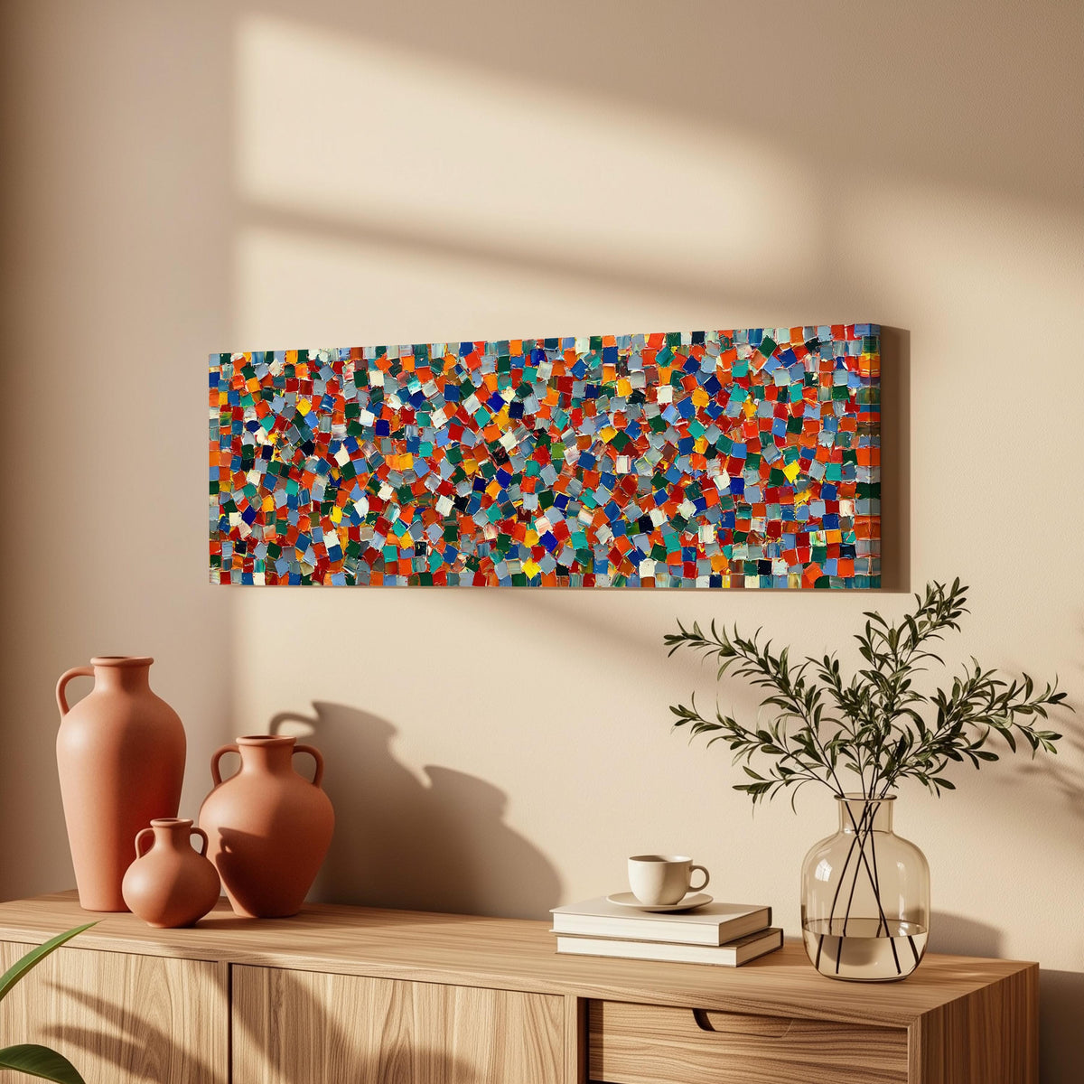 Colorful confetti mosaic squares long horizontal canvas print above a wooden sideboard