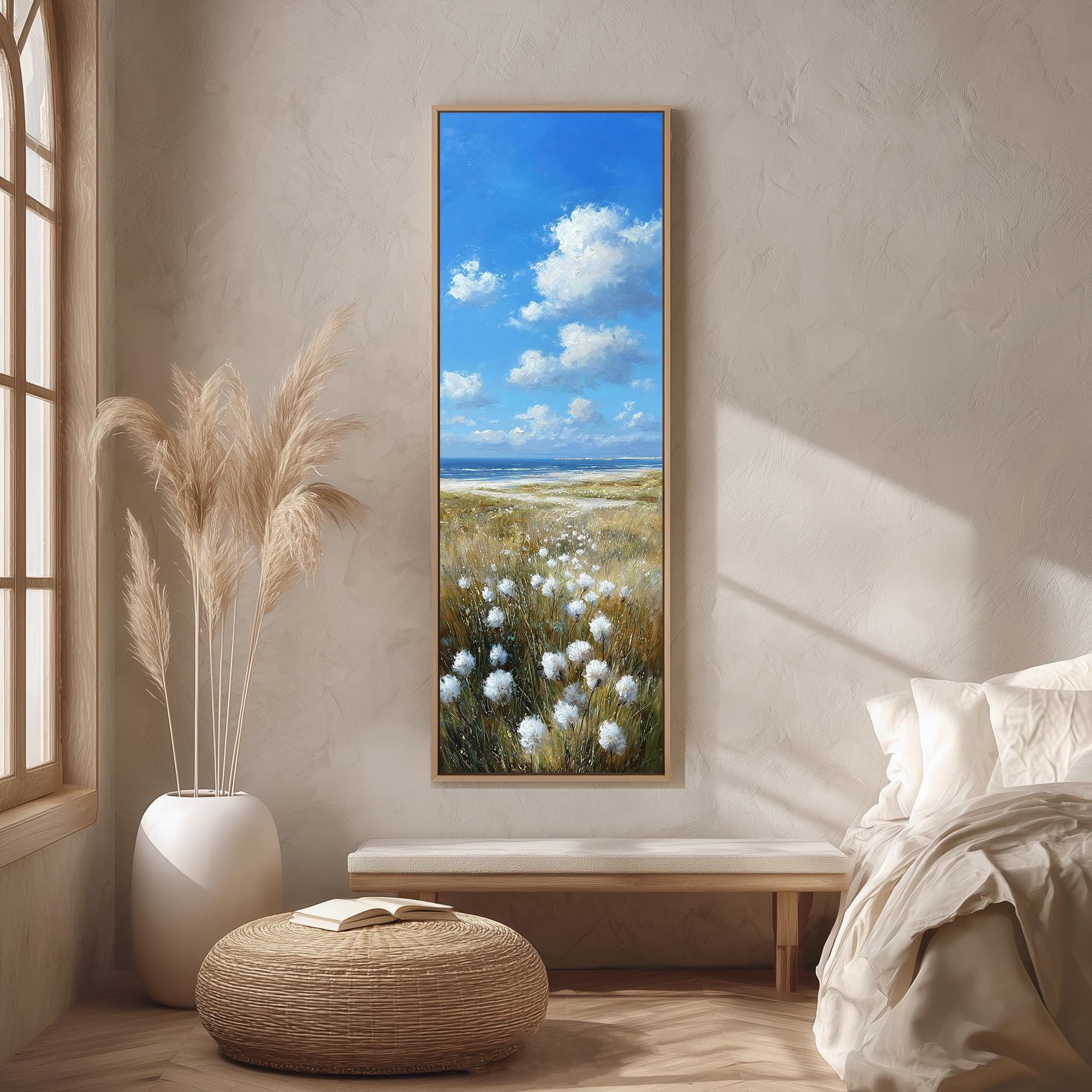 a serene bedroom scene with a large painting of a field of flowers hanging on the wall, a white bed with a white pillow, a white vase with tall potted plants, and a wooden bench.