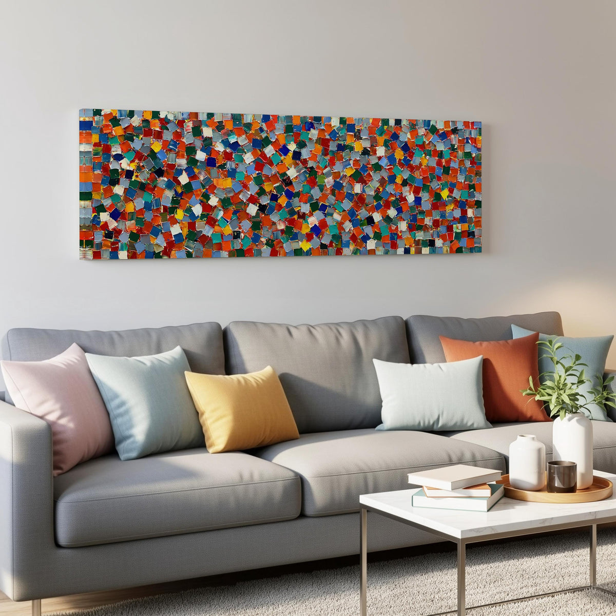 Colorful confetti mosaic squares panoramic canvas print above a grey sofa in a living room