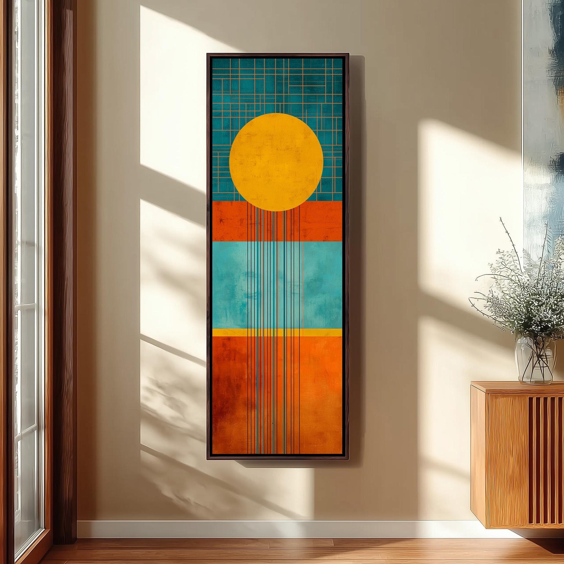 a large abstract painting hanging on a wall, with a wooden cabinet and a vase of flowers to the right of the painting.