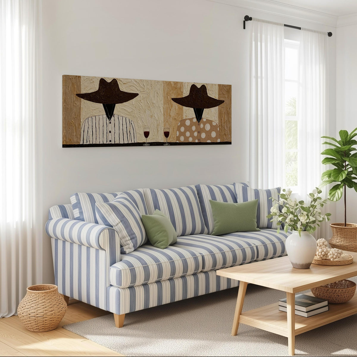 Two folk figures in hats toasting with red wine long horizontal canvas print above a striped sofa in a coastal living room