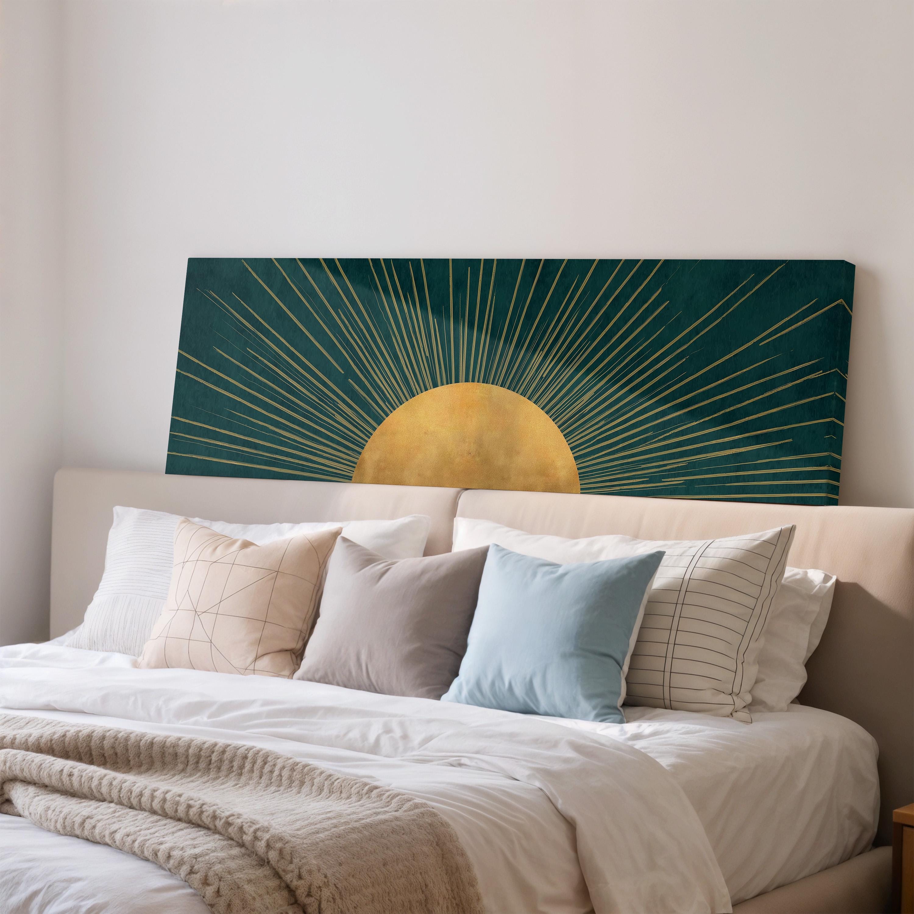 a large bed with a green and gold sun-like artwork on the wall behind it, creating a visually striking and modern bedroom design.