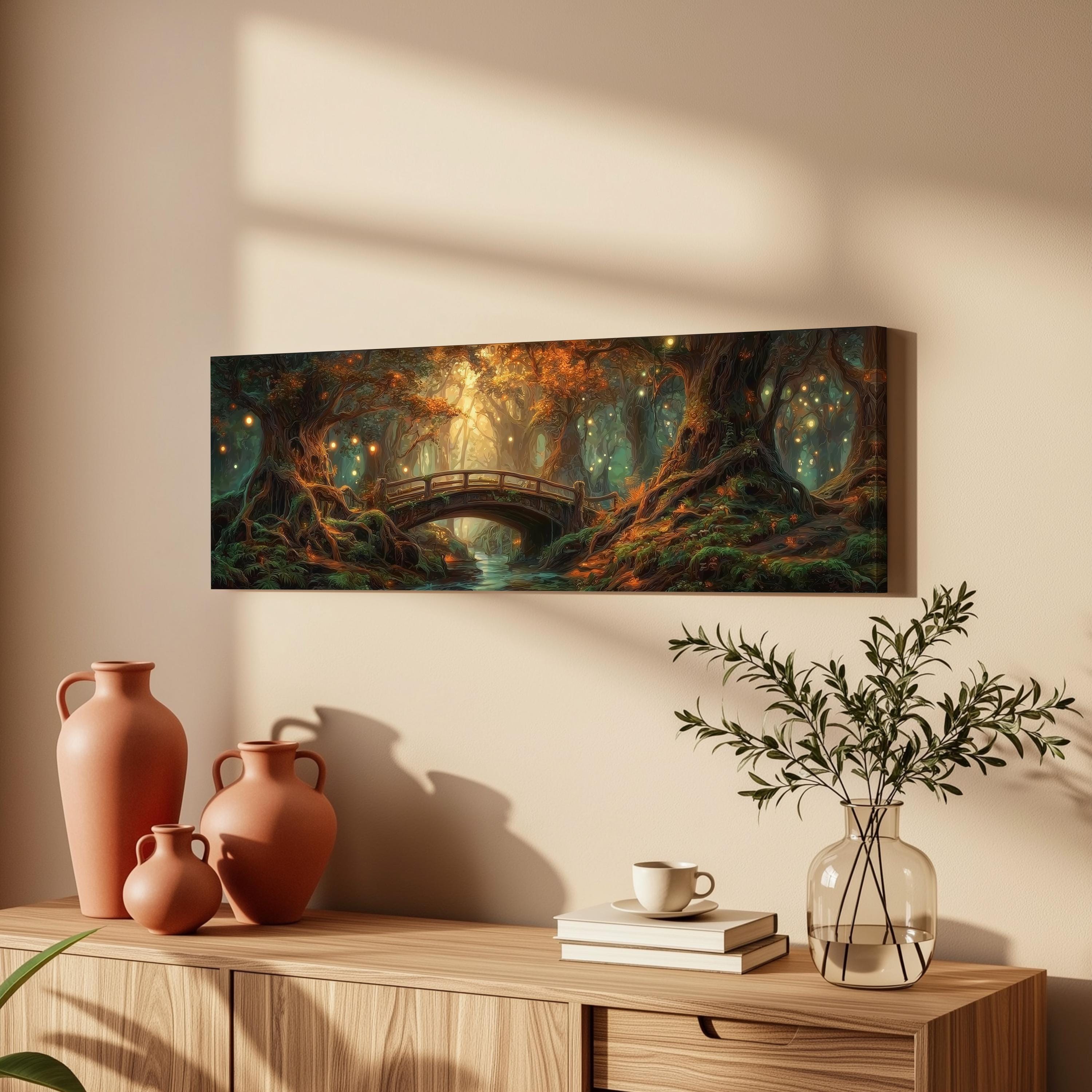 a large painting of a forest scene with a bridge, surrounded by various decorative elements such as vases, a potted plant, and books on a wooden table.