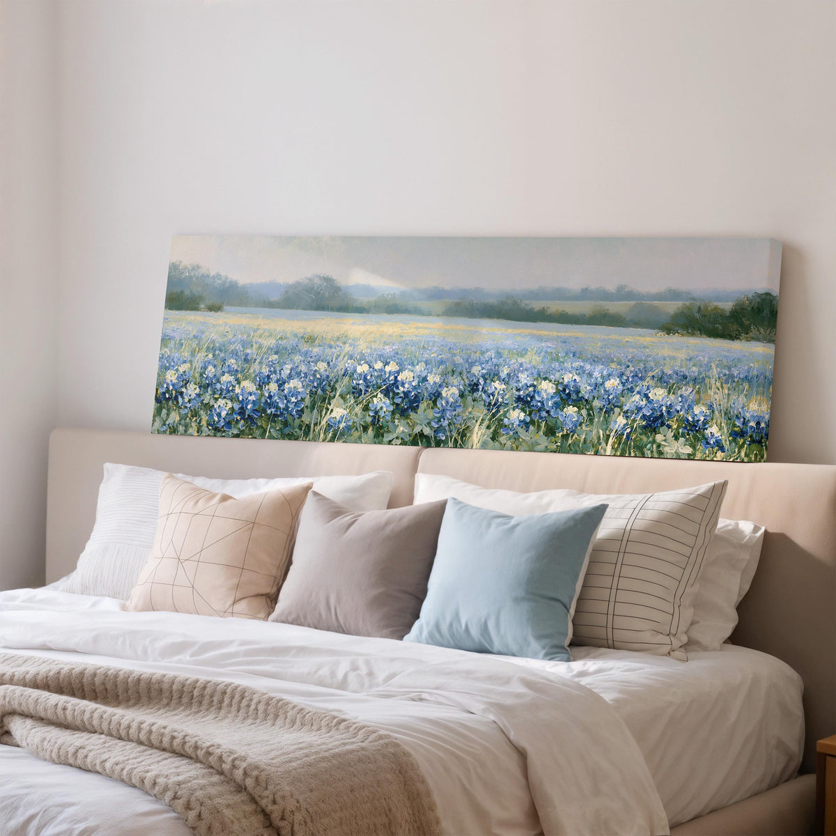Field of bluebonnets wide panoramic canvas print above a bed in a bedroom