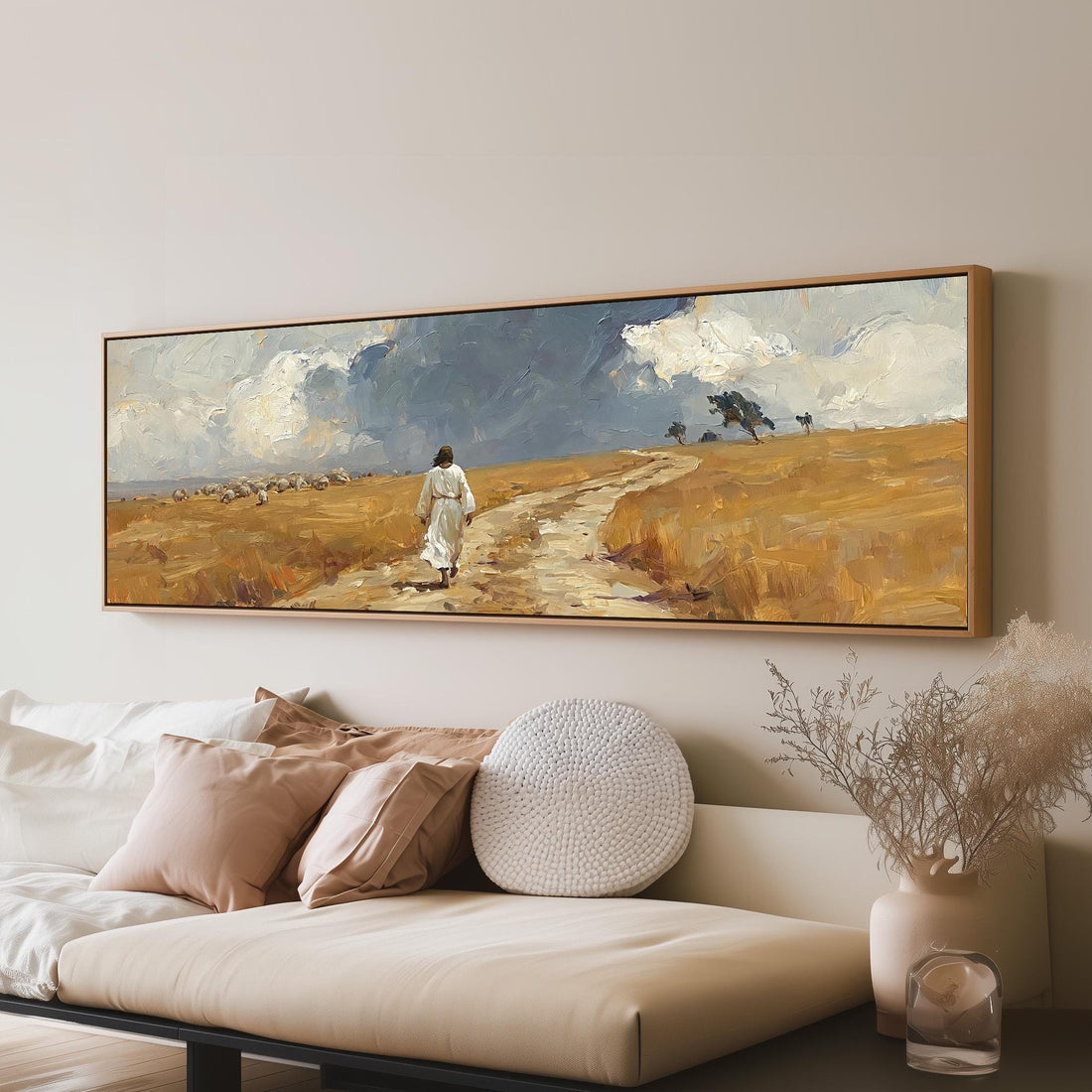 Jesus walking a field path with grazing sheep long horizontal canvas print above a sofa in a living room