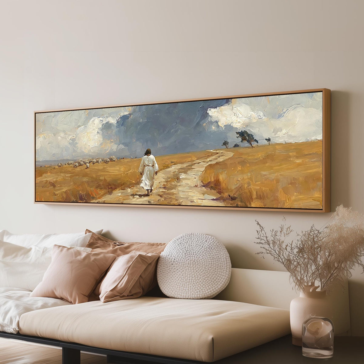 Jesus walking a field path with grazing sheep long horizontal canvas print above a sofa in a living room