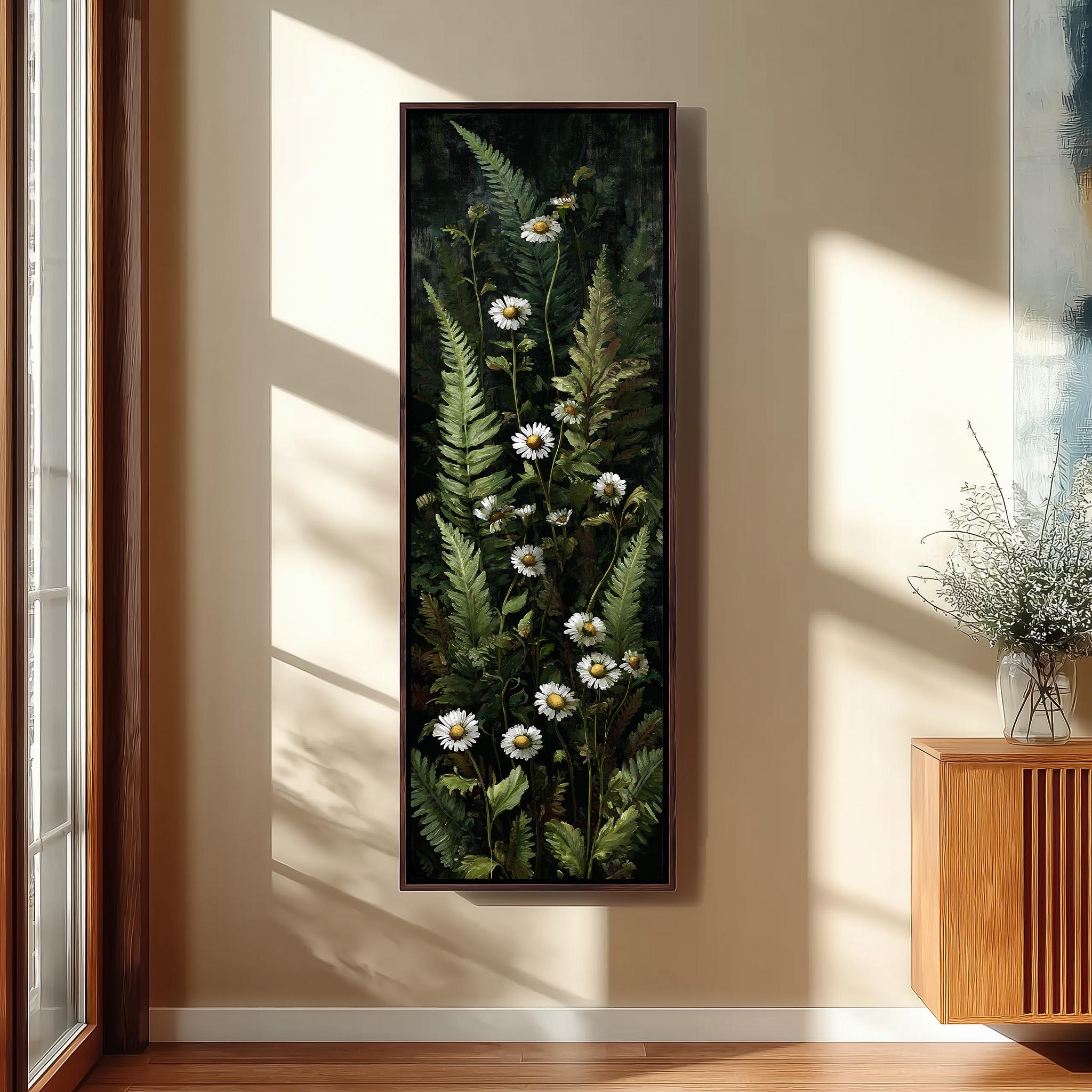 a large framed painting of white daisies and green ferns hanging on a wall in a room with a wooden cabinet and a window.