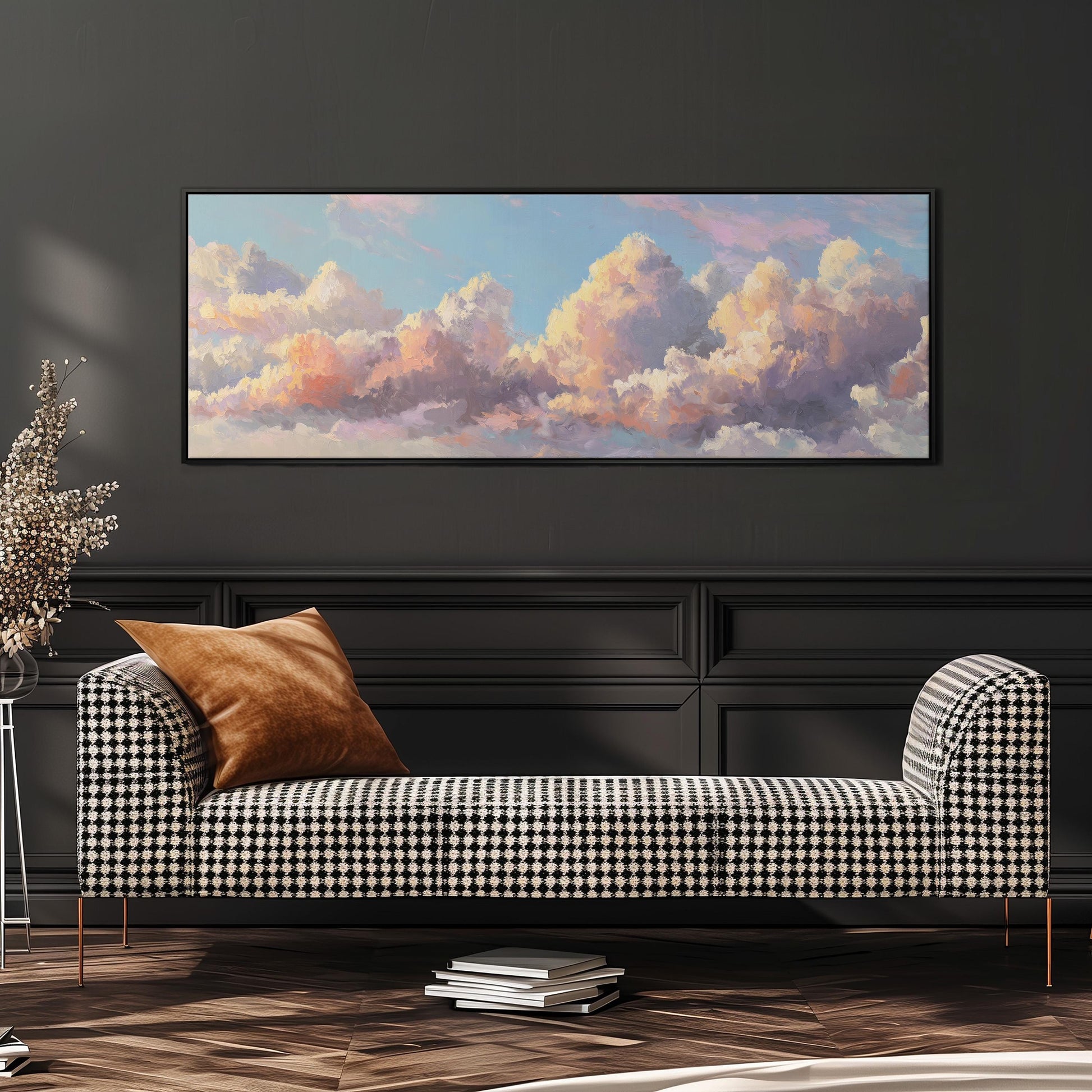 a large, rectangular painting of a cloudy sky hanging on a wall above a black and white checkered sofa.