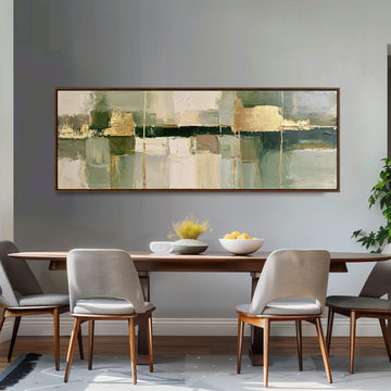 Sage and gold leaf abstract long horizontal canvas print above a sofa in a living room