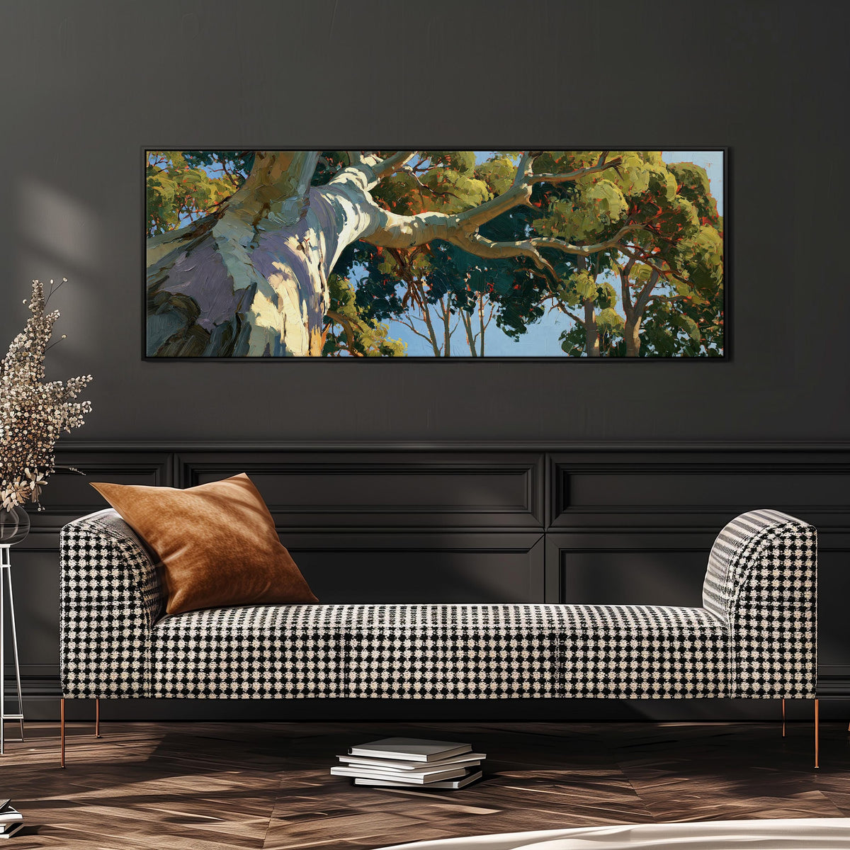 Sunlit eucalyptus trunk and branches wide panoramic canvas print above a bench in a dark living room
