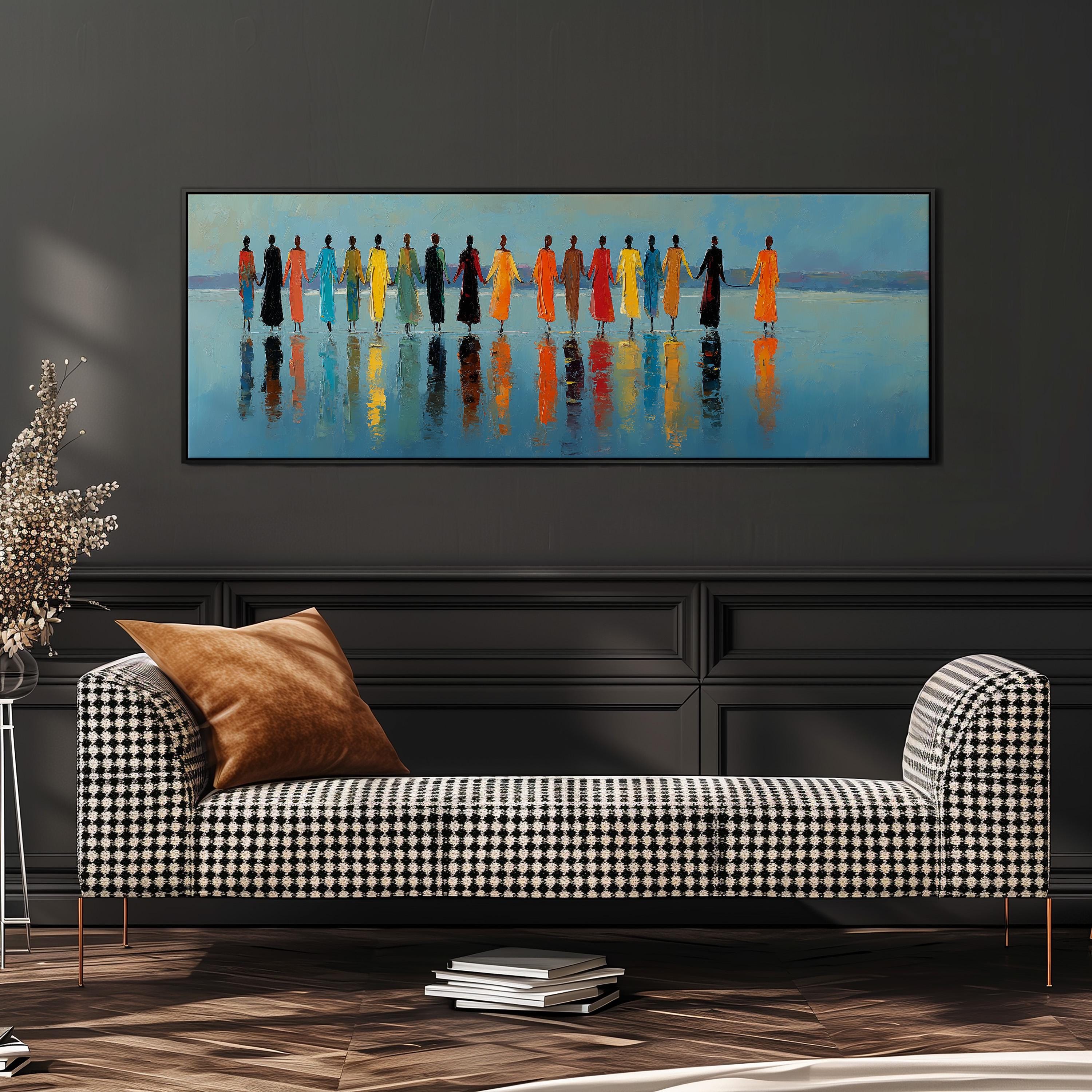 a large painting of a group of people standing in a line, with their reflections visible in the water below. The painting is displayed on a wall above a black and white checkered sofa, which is positioned in front of a bookshelf.
