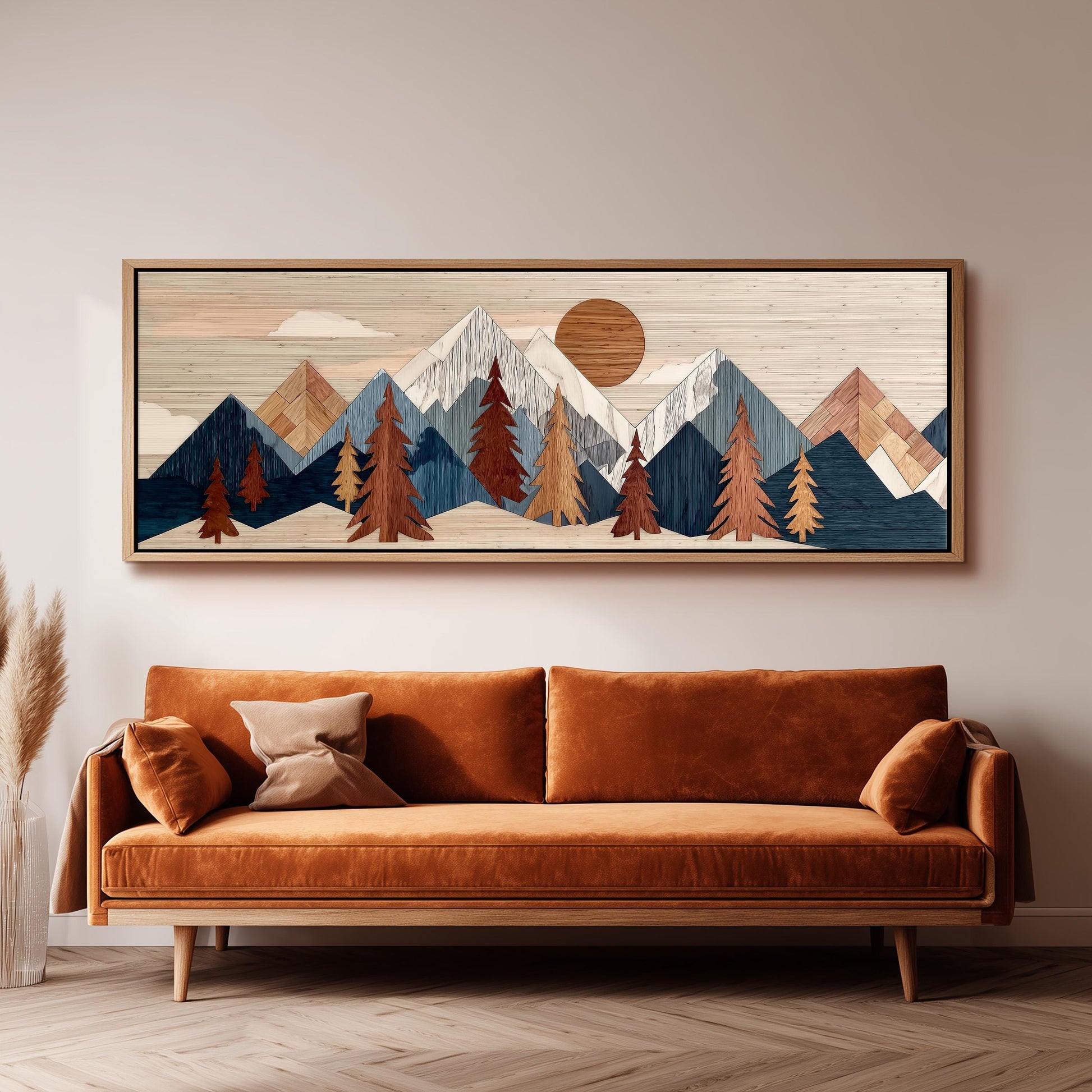 a large, rectangular wooden frame hanging on a wall above a brown sofa with orange cushions.
