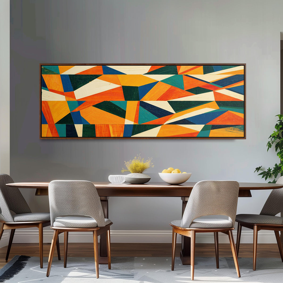 Orange and teal triangle mosaic long horizontal canvas print above a dining table