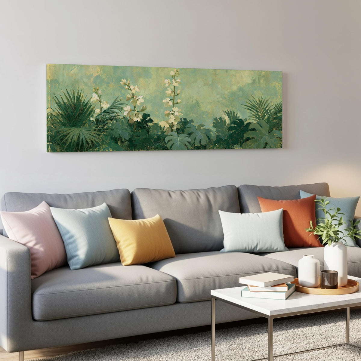 Tropical white blooms in green foliage panoramic canvas print above a grey sofa in a living room