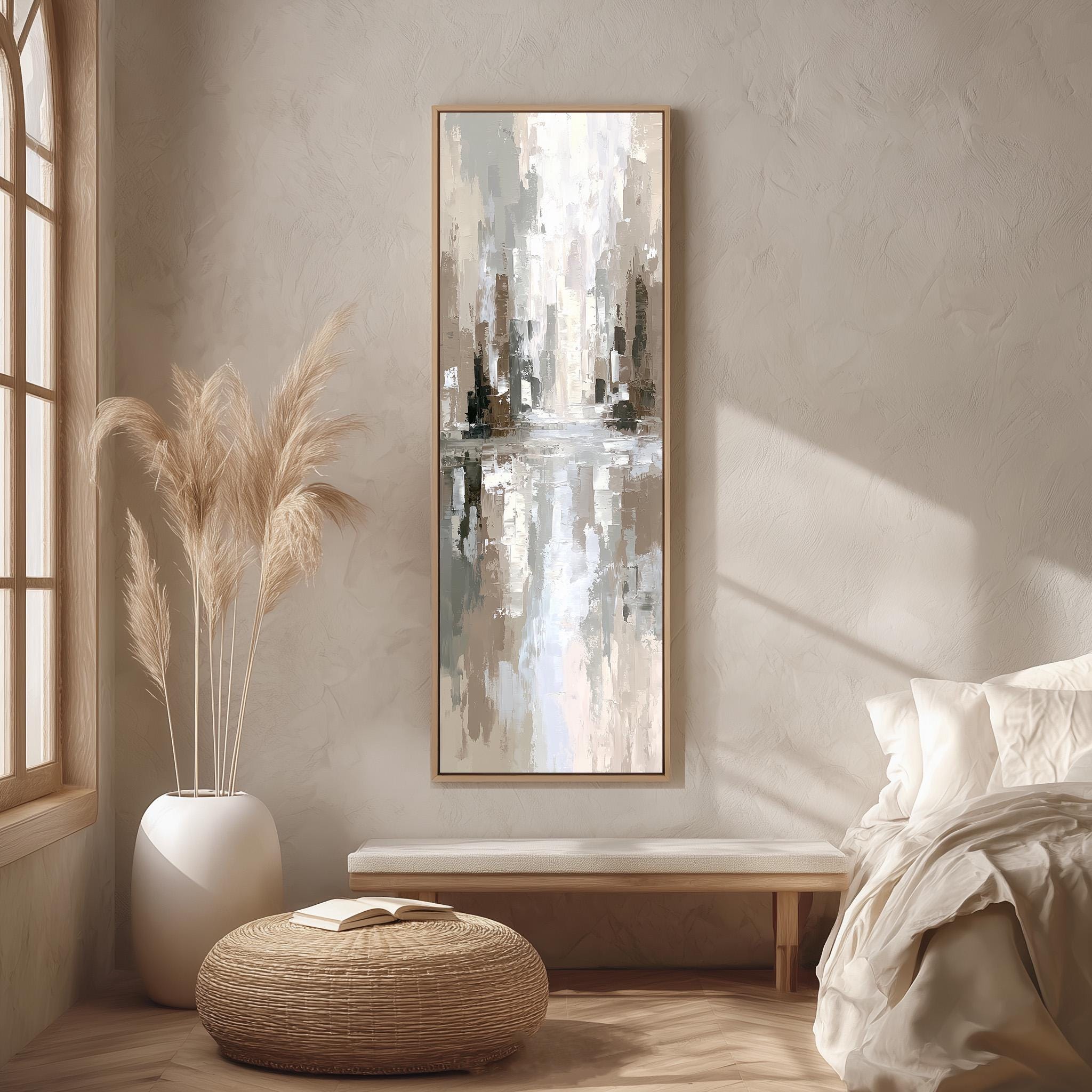 a serene and modern bedroom with a large abstract painting hanging on the wall, a white bed with a white pillow, a white vase with tall potted plants, and a woven ottoman.