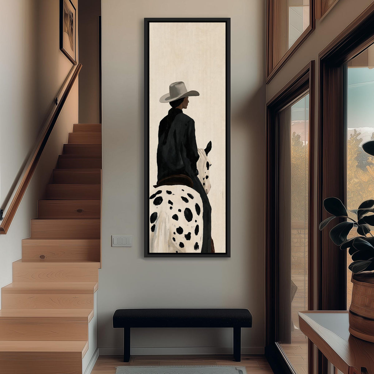 Cowgirl on a spotted appaloosa from behind tall narrow canvas print beside a staircase in an entryway