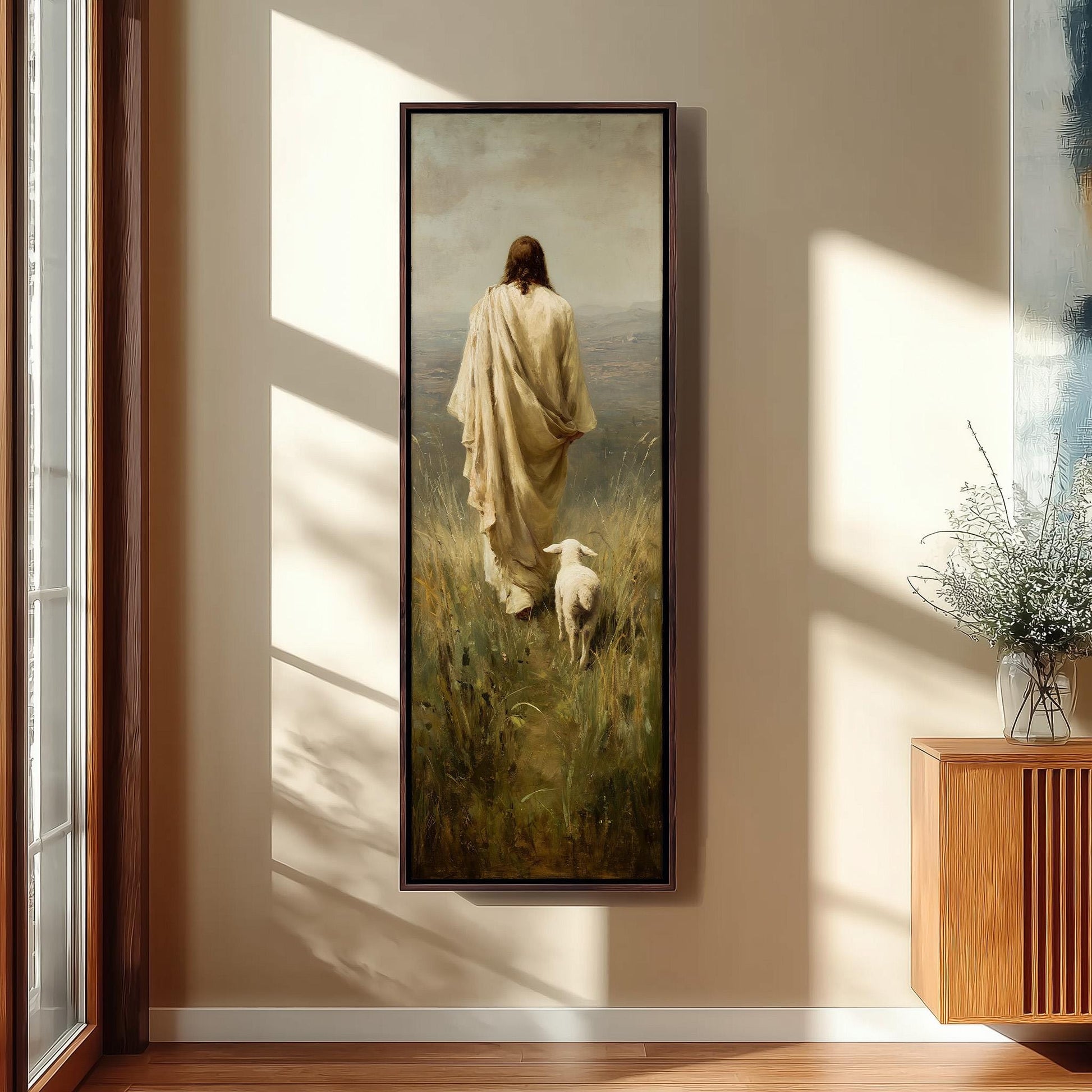 a person in a long robe walking through a field with a sheep, with a vase of flowers on a side table.
