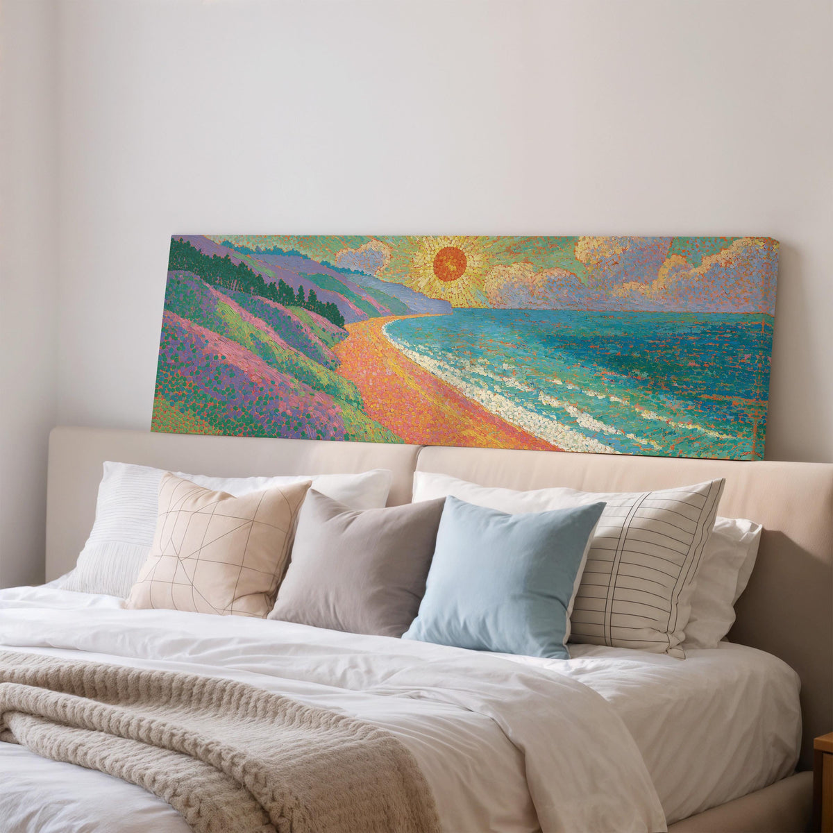 Coastal cliffs at sunset wide panoramic canvas print above a bed in a bedroom