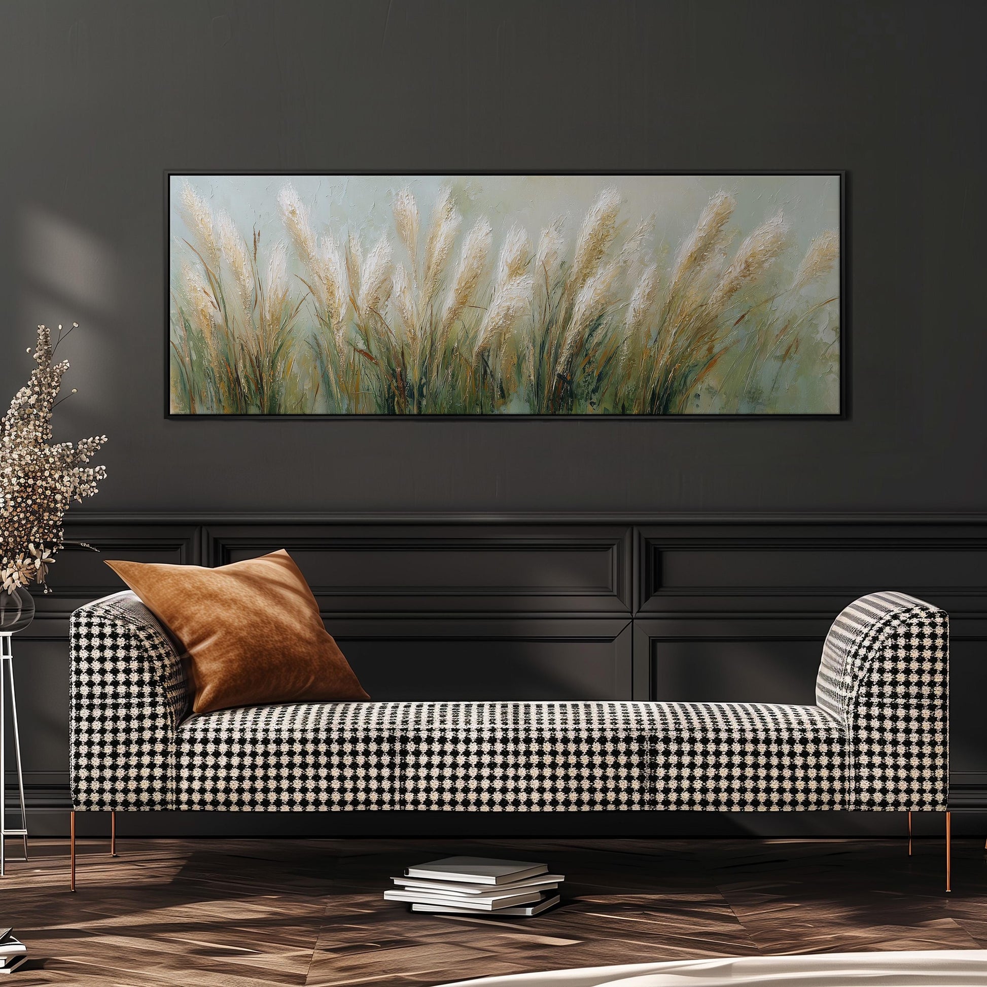 a black and white checkered sofa with a brown throw pillow, set against a dark wall with a large painting of tall grasses hanging above it.