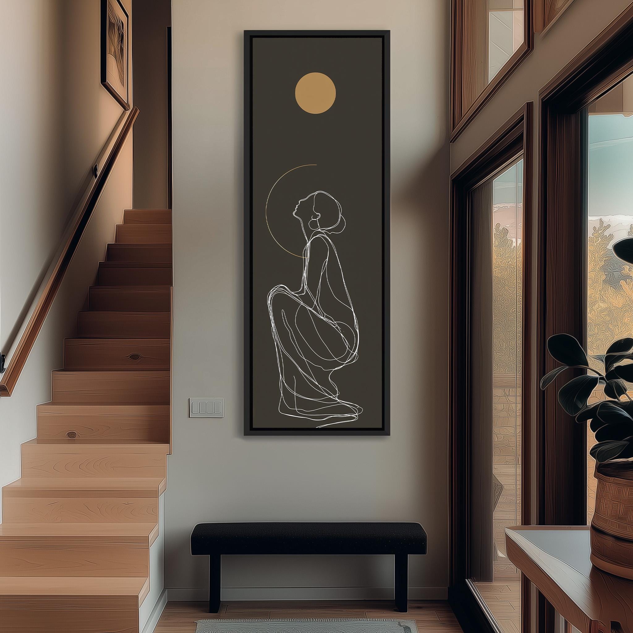 a minimalist interior design with a large abstract drawing of a woman on the wall, a wooden staircase, a black bench, and a potted plant.