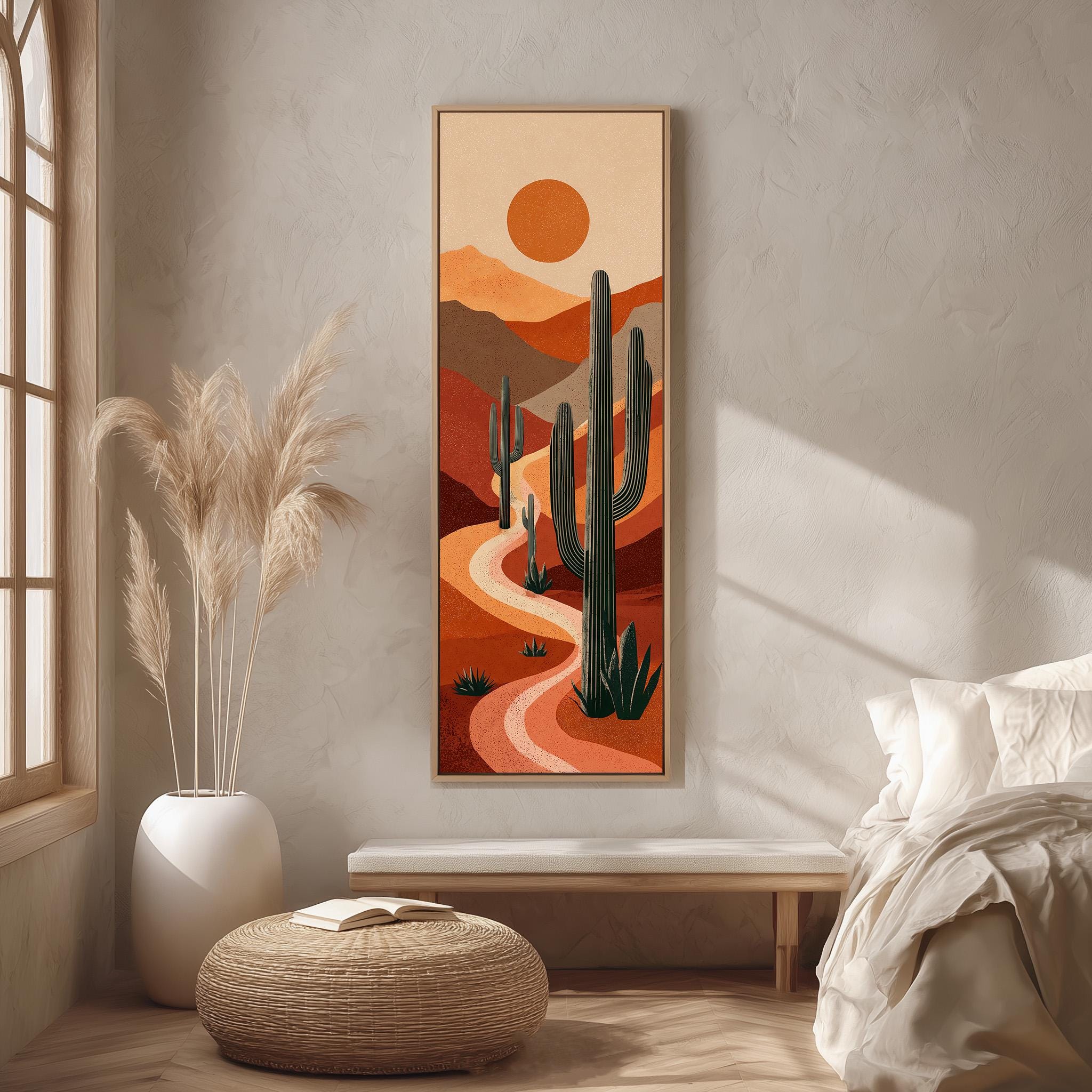 a desert landscape with a winding path, cacti, and a sun in the sky. The scene is framed and hung on a wall, creating a desert-themed atmosphere.