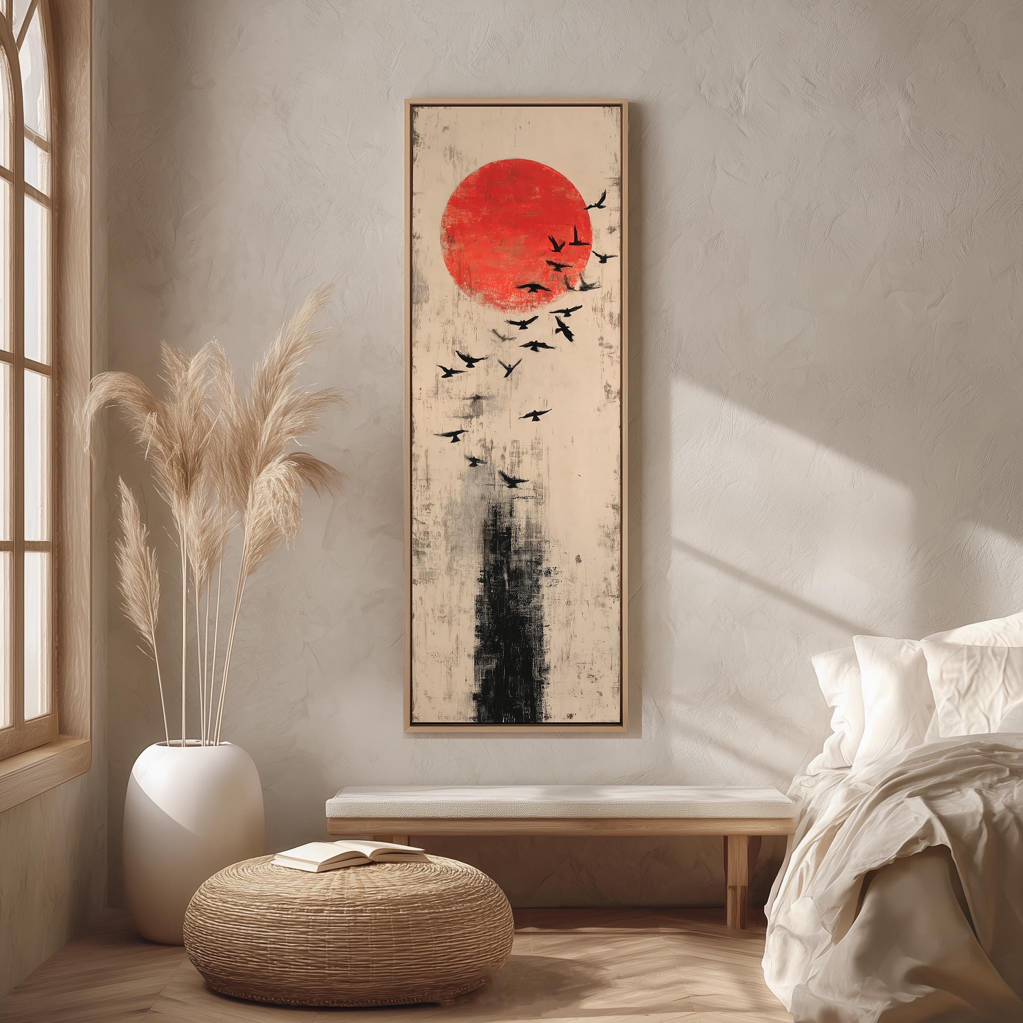 a minimalist bedroom setting with a large abstract painting hanging on the wall, a white bed with a white pillow, a white vase with tall potted plants, and a woven ottoman.