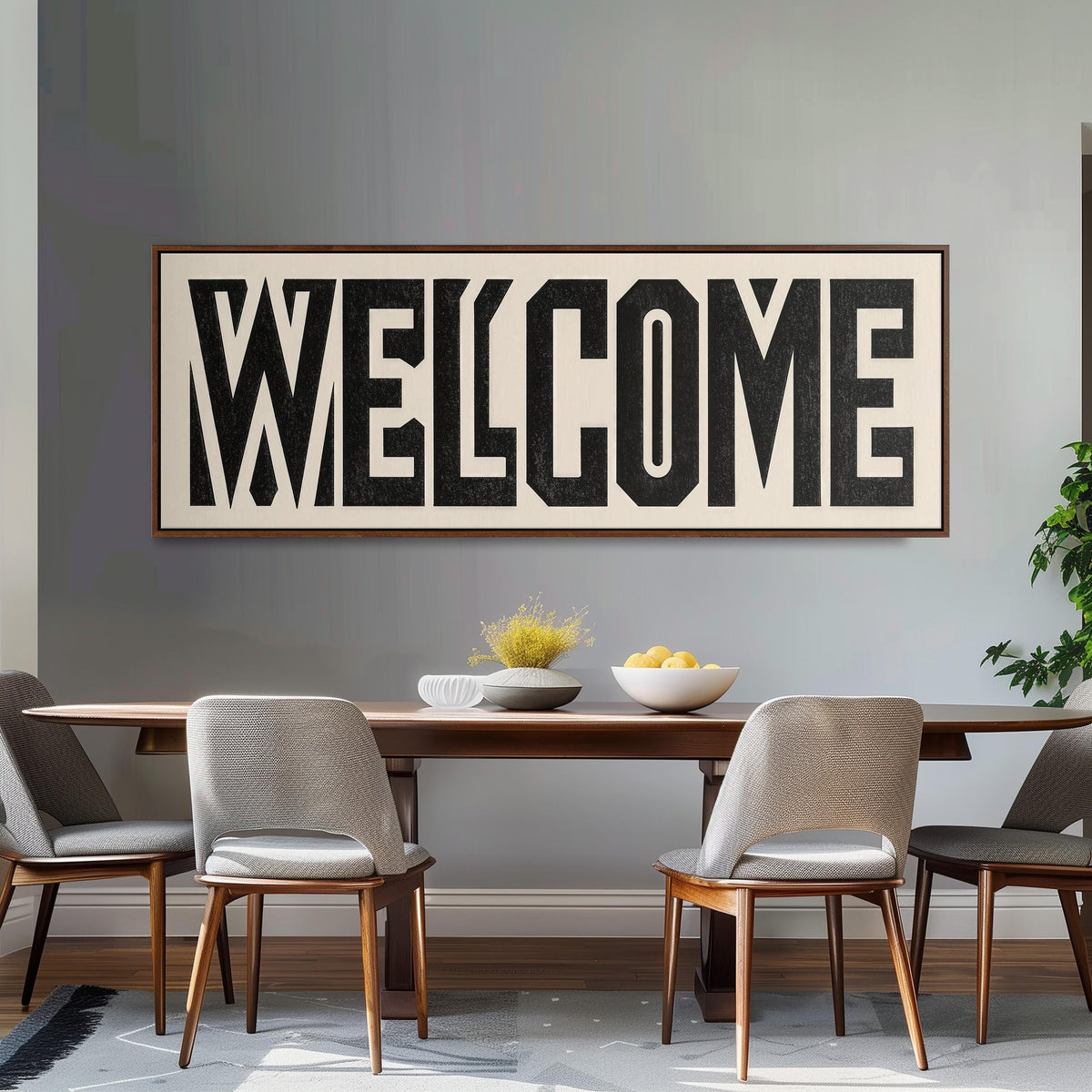 Bold welcome block letters long horizontal canvas print above a dining table