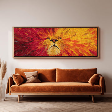 a large, vibrant painting of a lion's face hanging on a wall above a brown sofa.