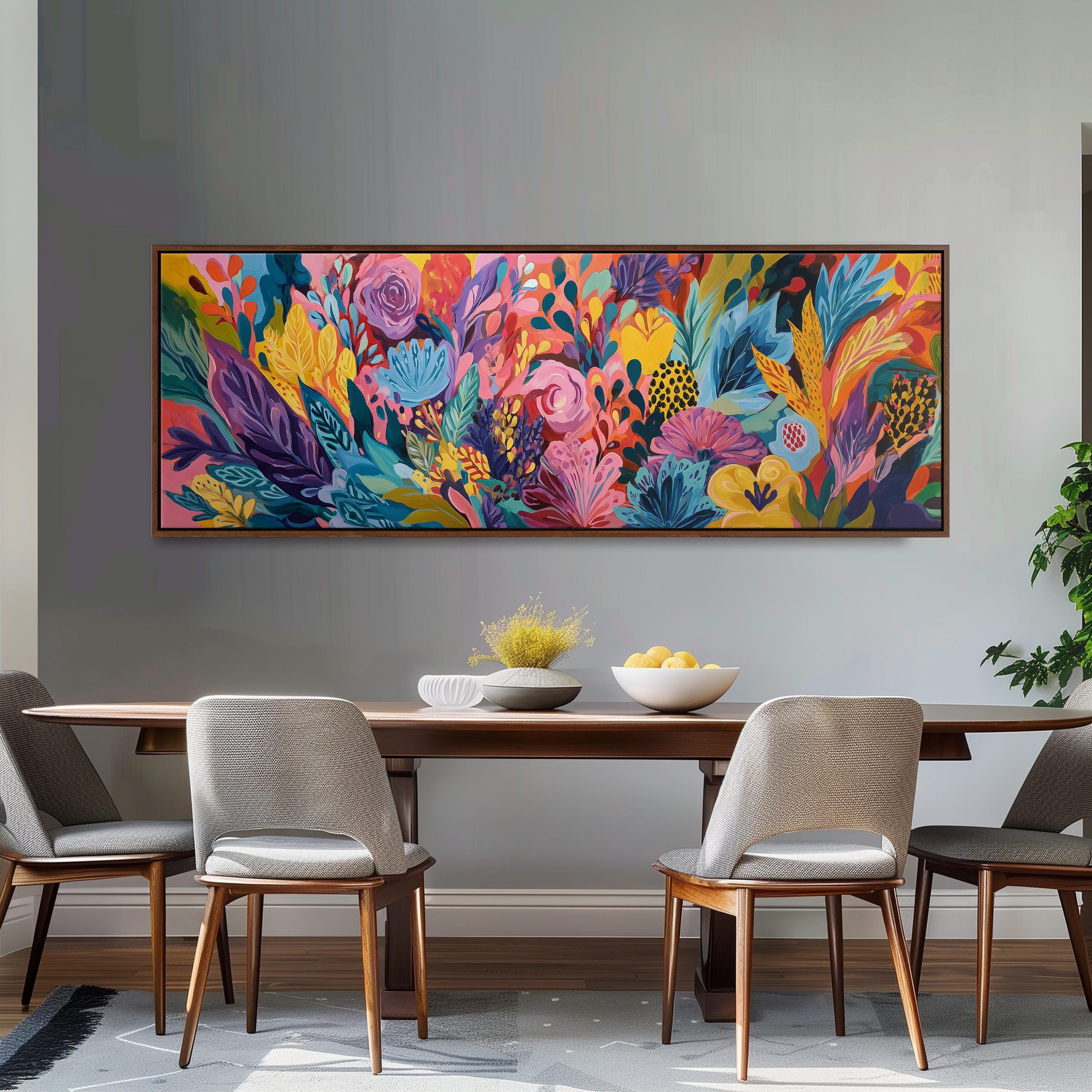 a dining room with a large, colorful painting of flowers hanging on the wall above a wooden dining table with four chairs.
