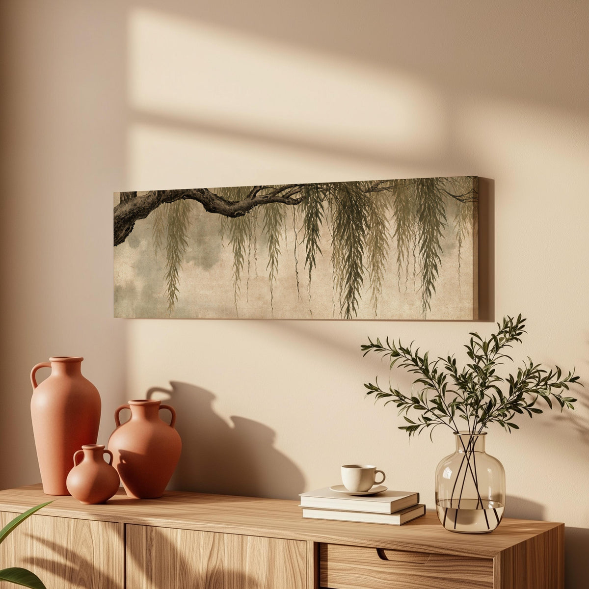 Hanging willow branches long horizontal canvas print above a wooden sideboard