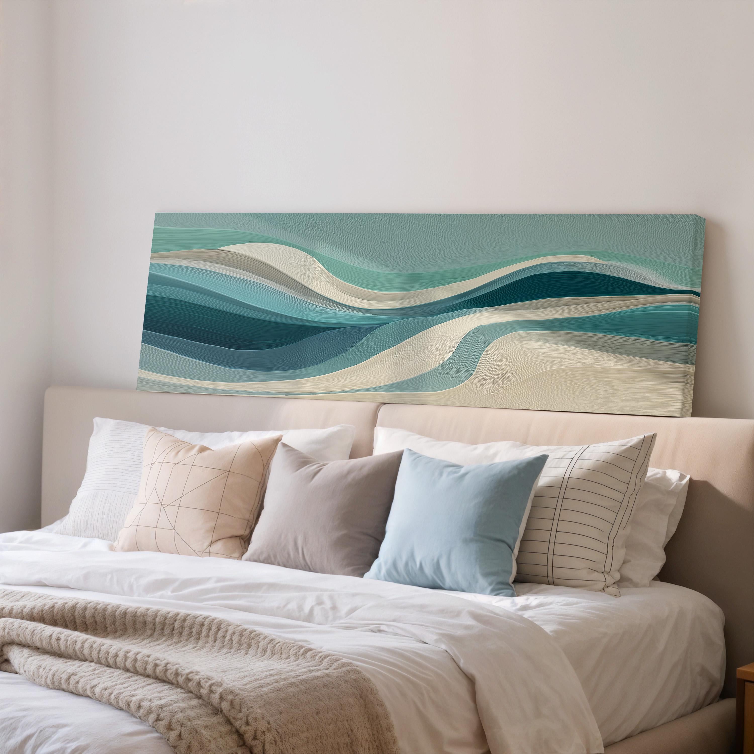 a large, white bed with a blue and white abstract painting hanging above it.