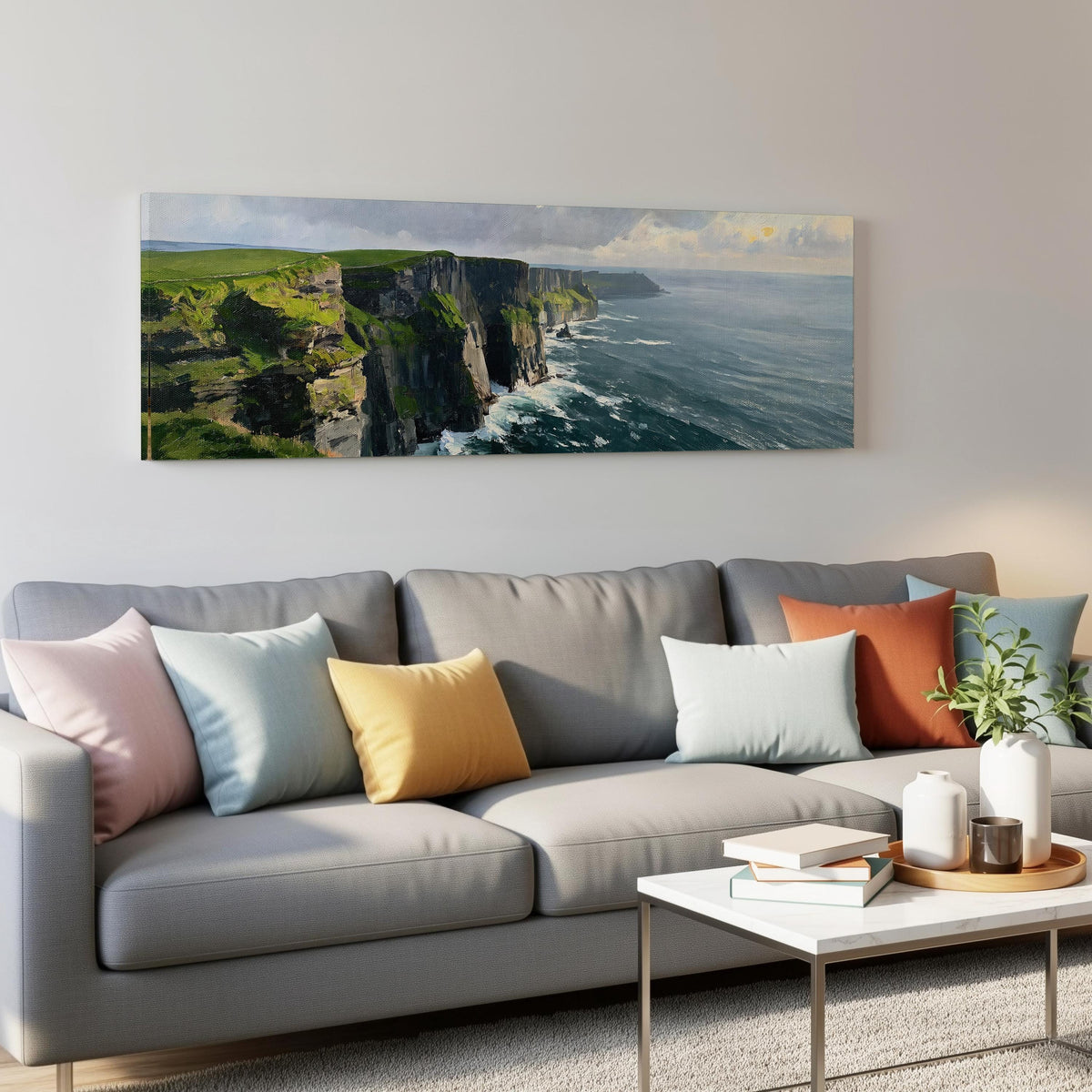 Emerald sea cliffs panoramic canvas print above a grey sofa in a living room
