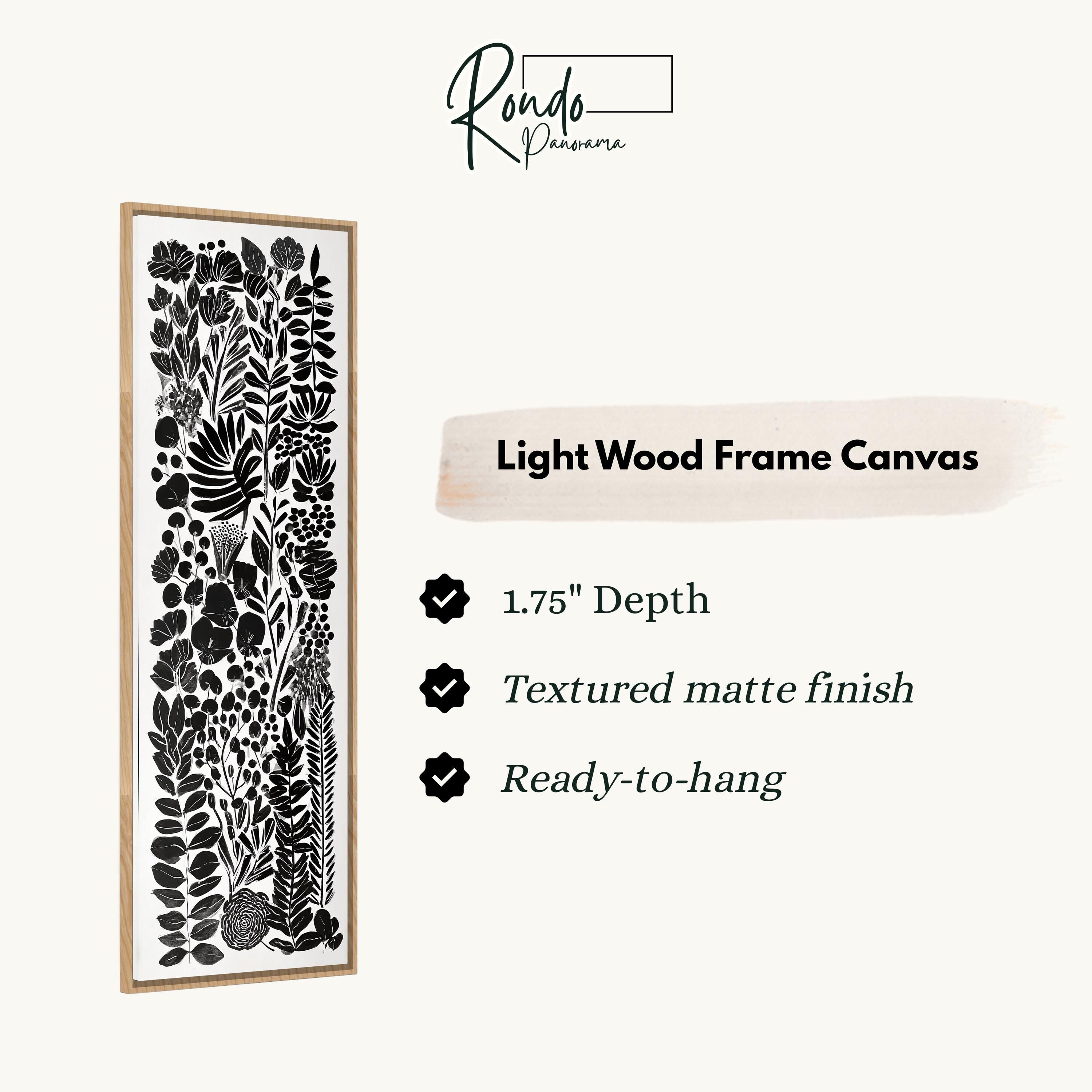 a light wood frame canvas with a black and white floral pattern.