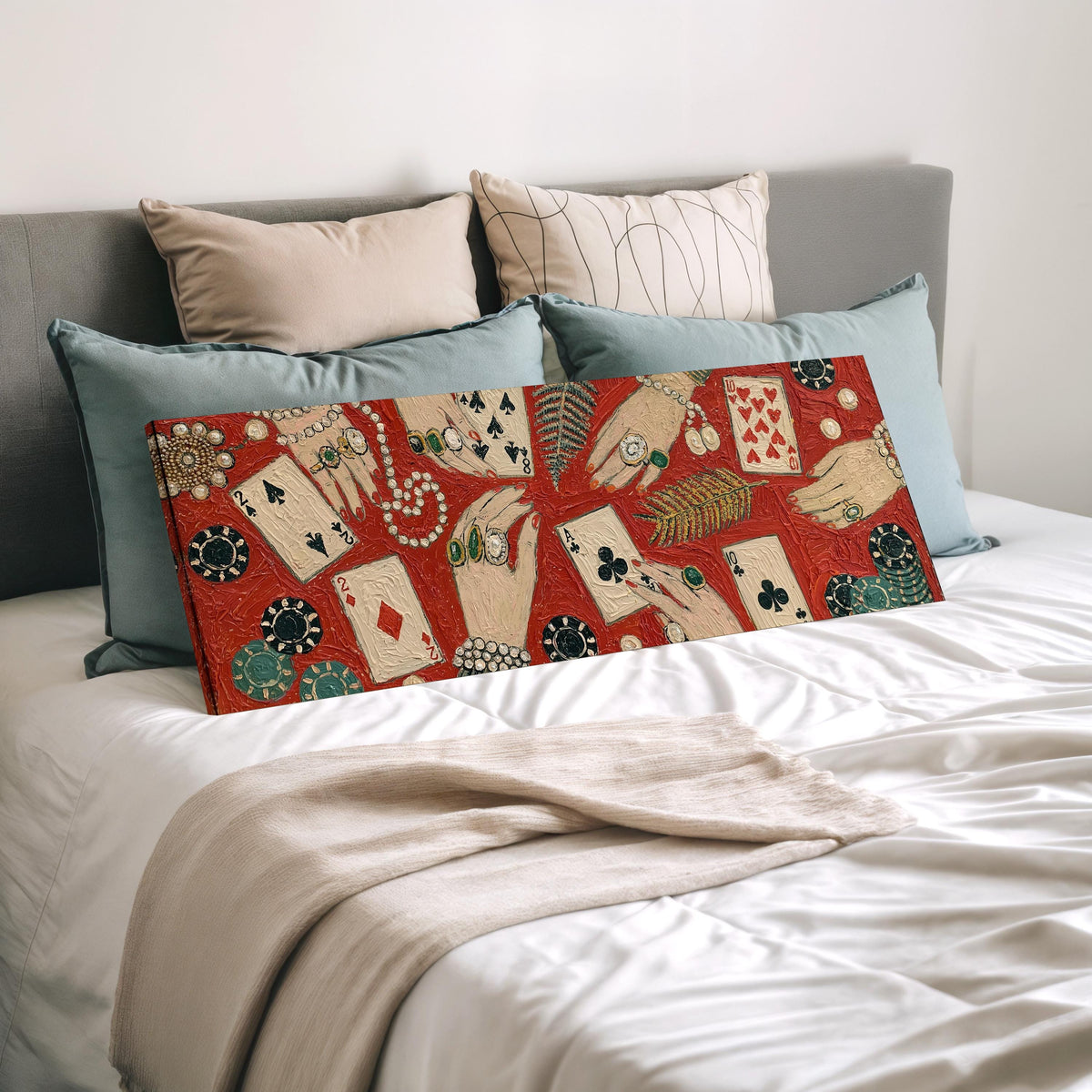 Playing cards, chips and jeweled hands wide panoramic canvas print laid on a bed to show its size