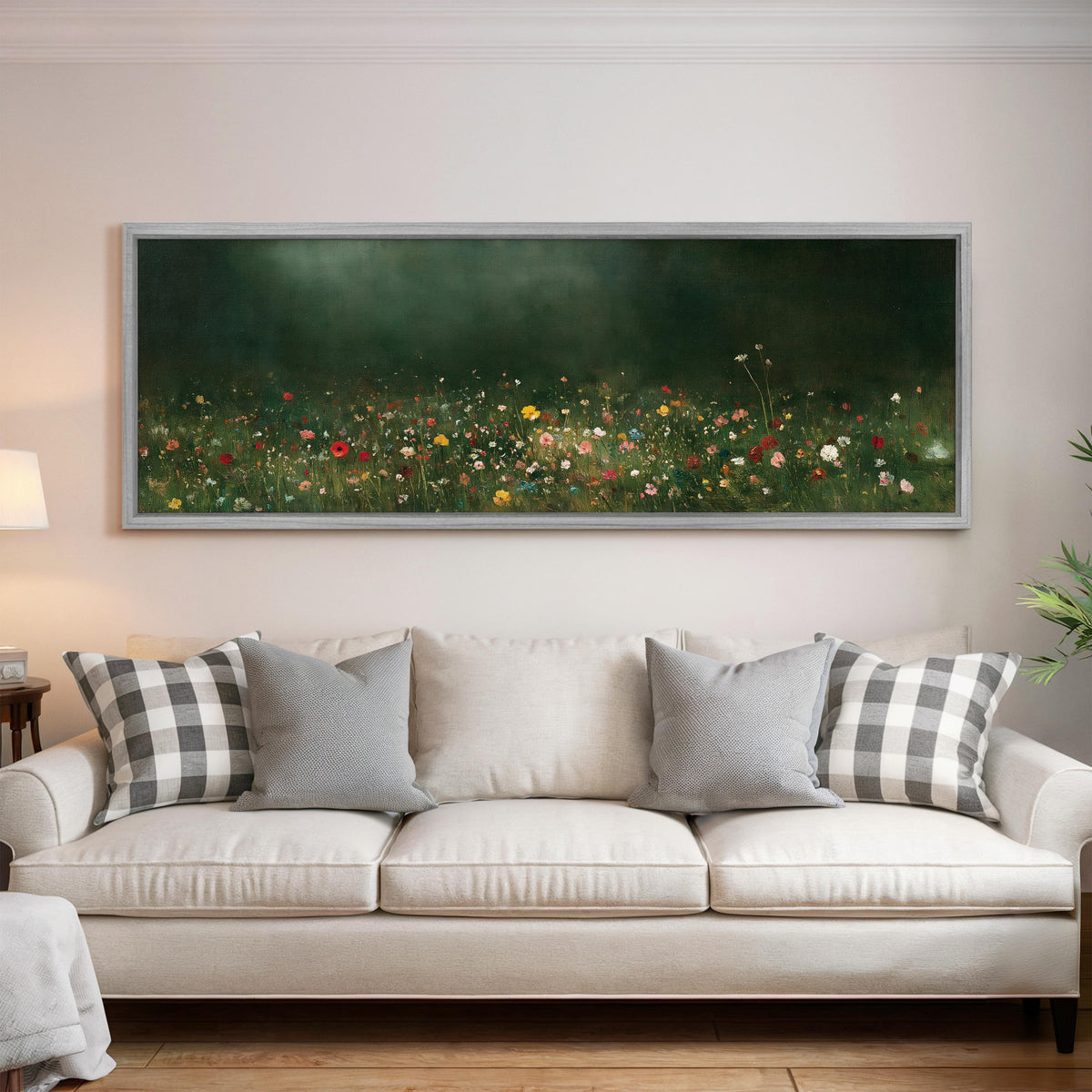 Wildflower meadow at the edge of a dark forest panoramic canvas print above a white sofa in a bright living room