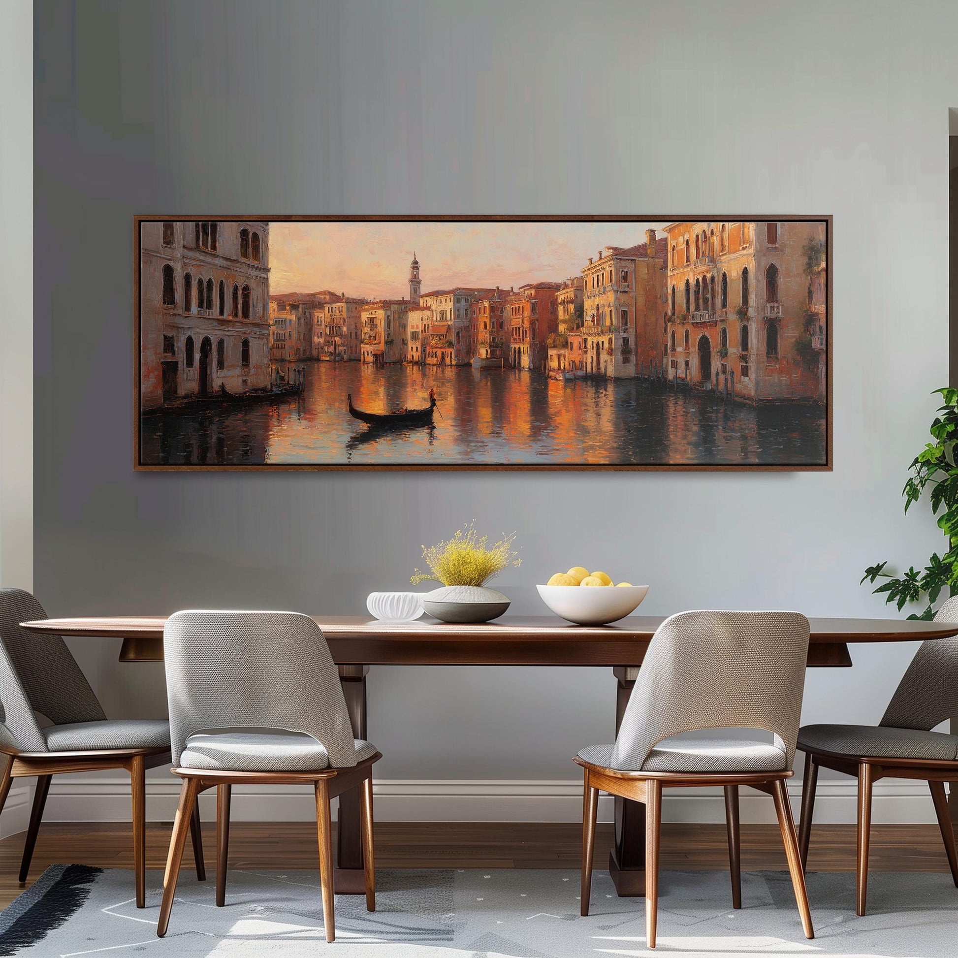 a dining room with a large painting of a cityscape above a wooden table with four chairs. The painting depicts a canal with a gondola and buildings lining the waterway, creating a picturesque scene.