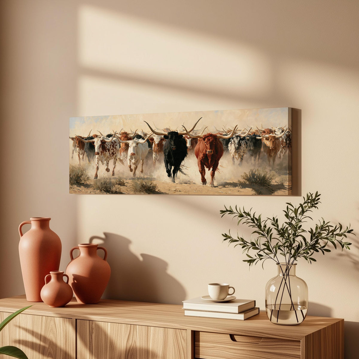 Longhorn cattle stampede long horizontal canvas print above a wooden sideboard