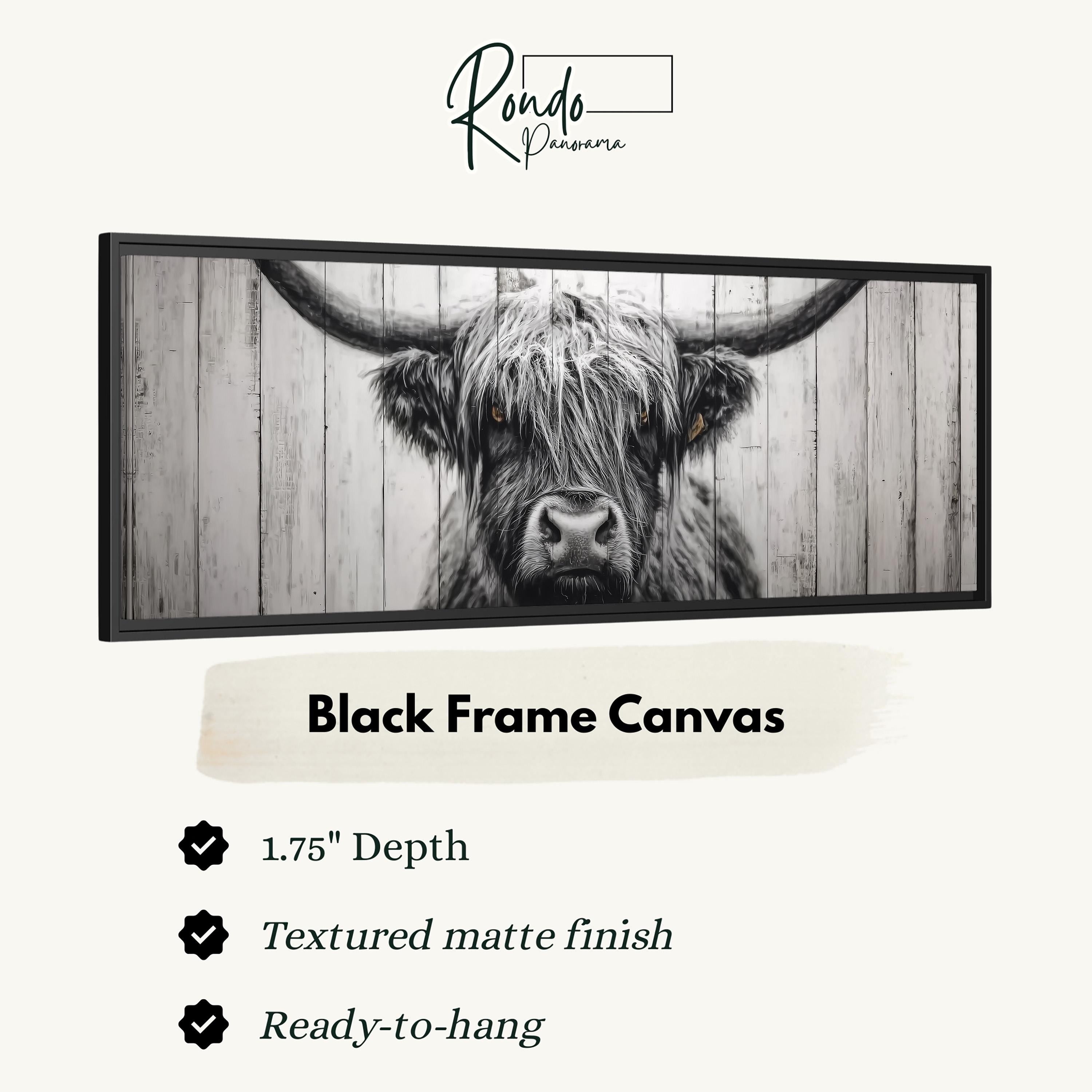The image is a black and white photograph of a bull's head in a wooden fence.