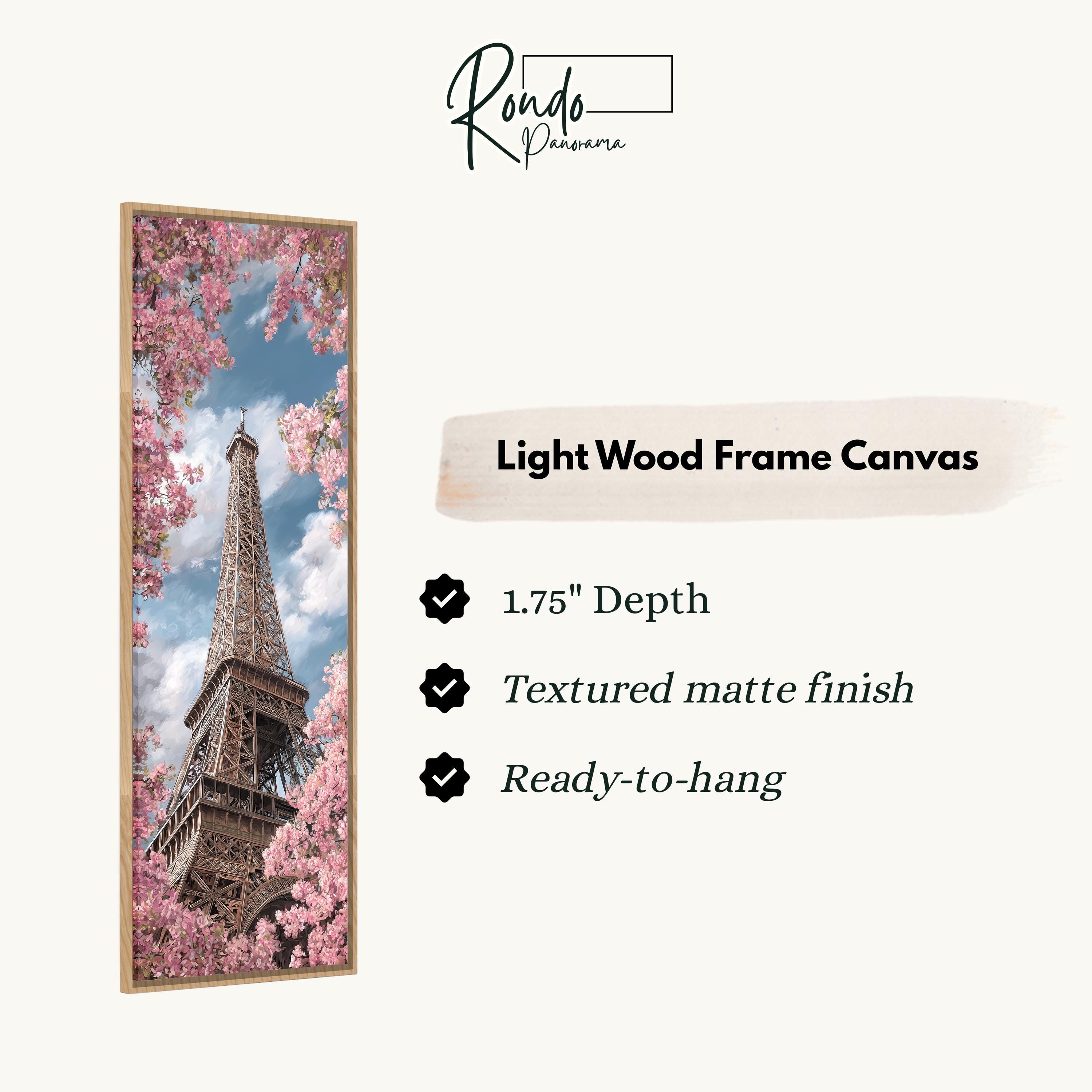 a light wood frame canvas depicting the Eiffel Tower surrounded by pink cherry blossoms.