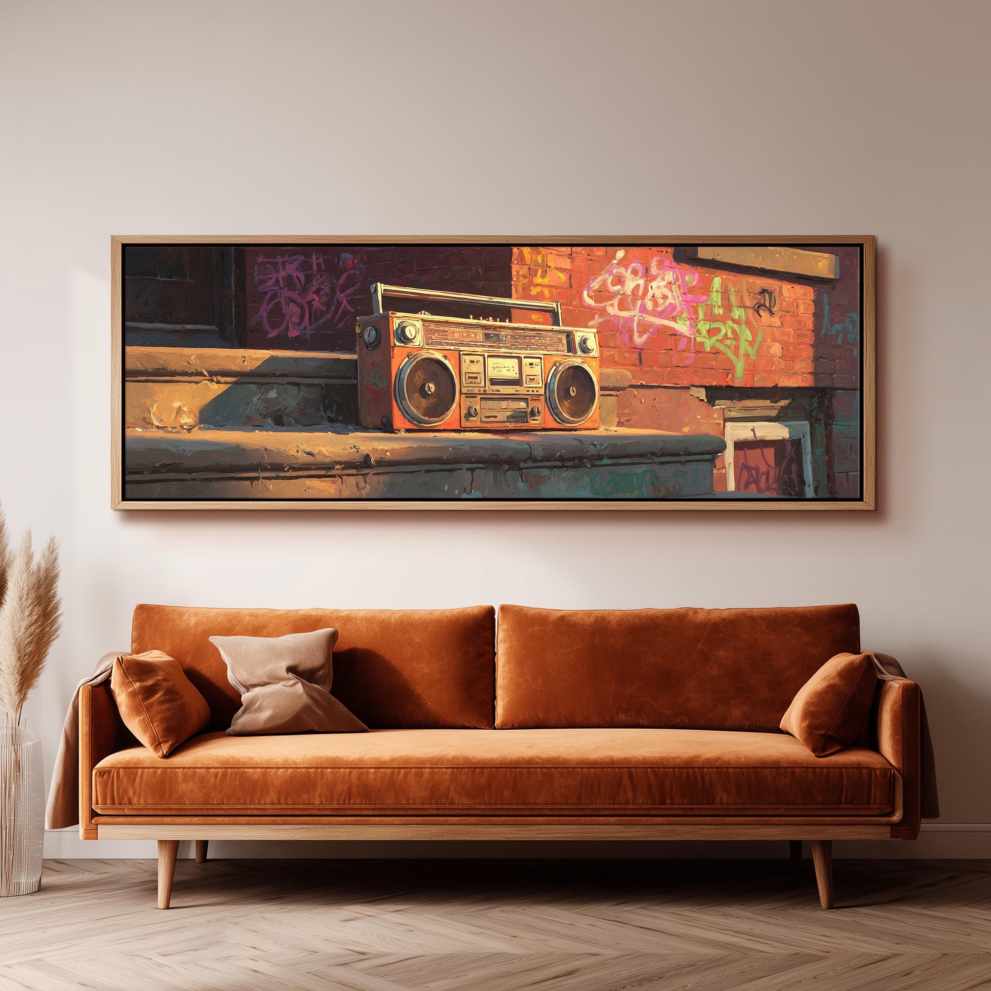 a large, framed painting of a vintage boombox on a wall above a brown sofa in a living room setting.
